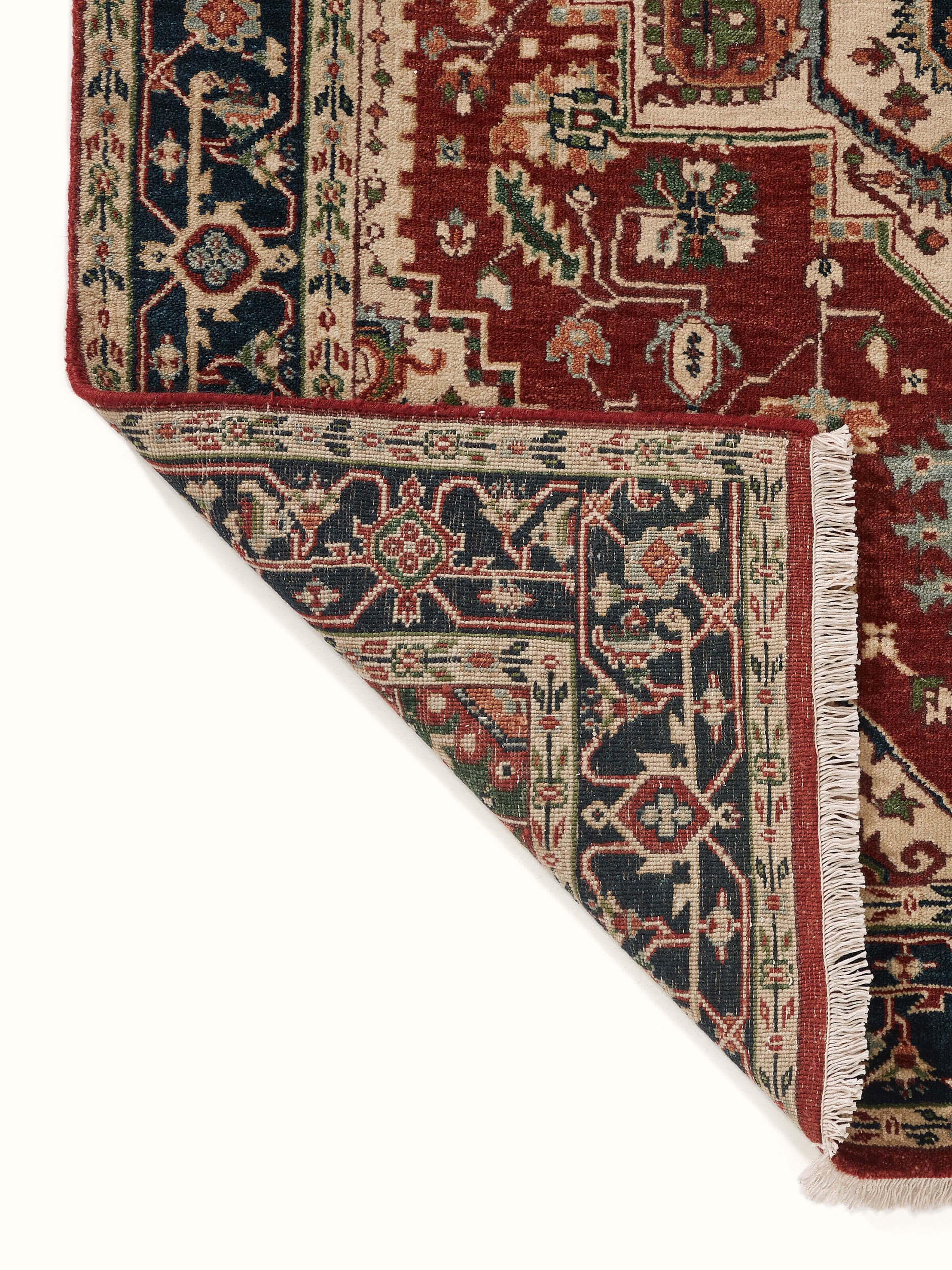 Back view of Traditional Heriz rust Bhadohi wool hand-knotted rug displaying construction and quality details