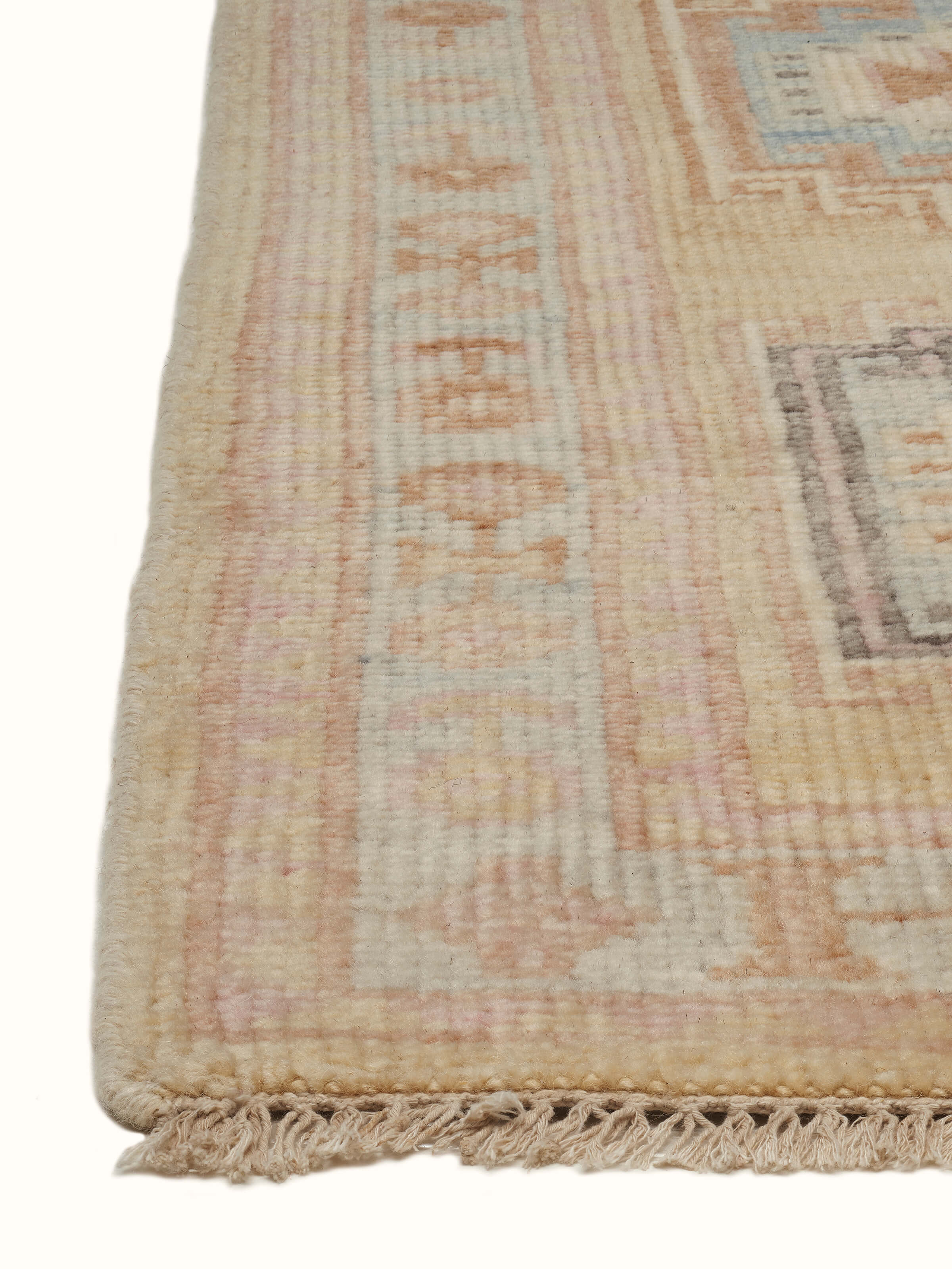 Angled view of Traditional Khotan yellow Bhadohi wool hand-knotted rug emphasizing rich color tones