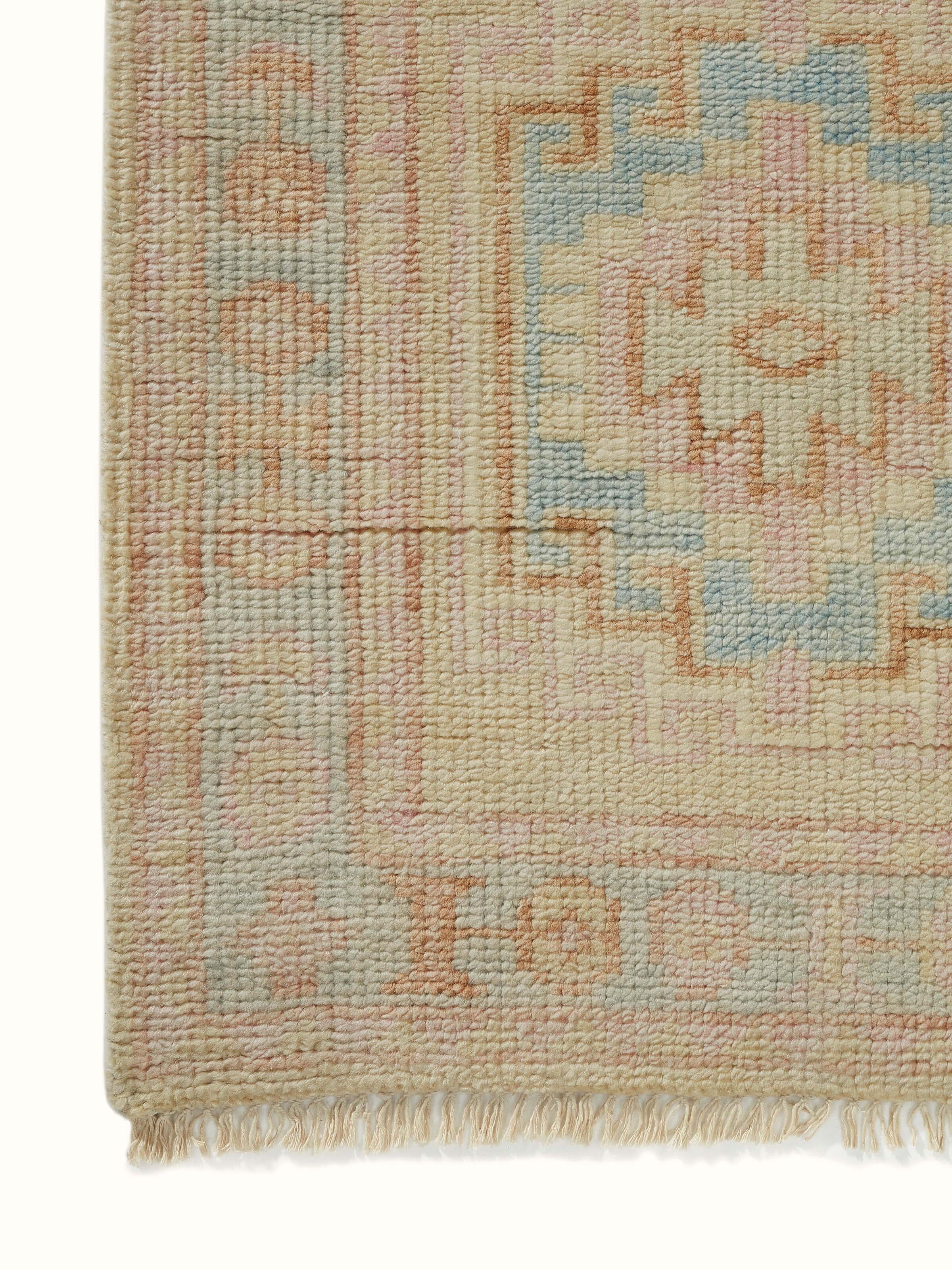 Close-up of Traditional Khotan yellow Bhadohi wool hand-knotted rug focusing on detailed weaving techniques