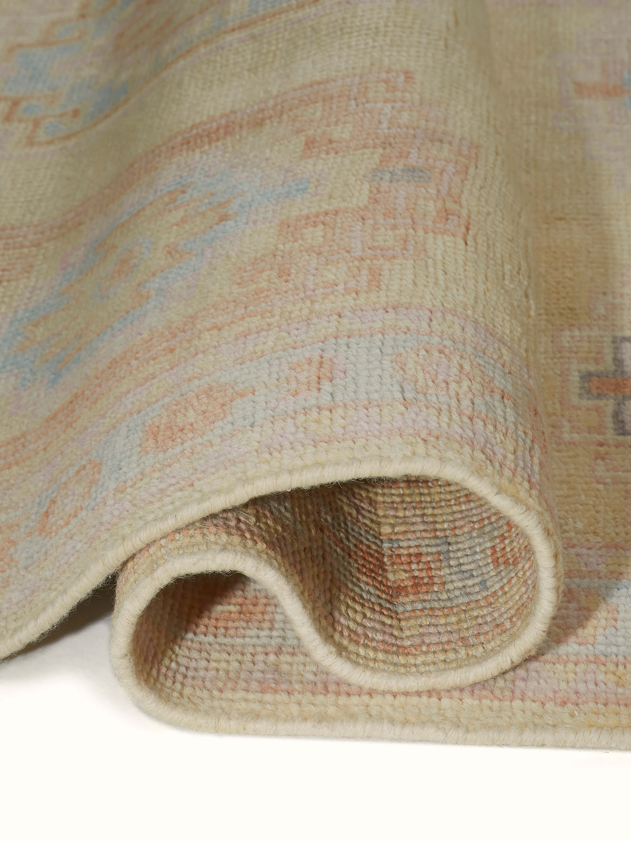 Full view of Traditional Khotan yellow Bhadohi wool hand-knotted rug laid out in an interior space