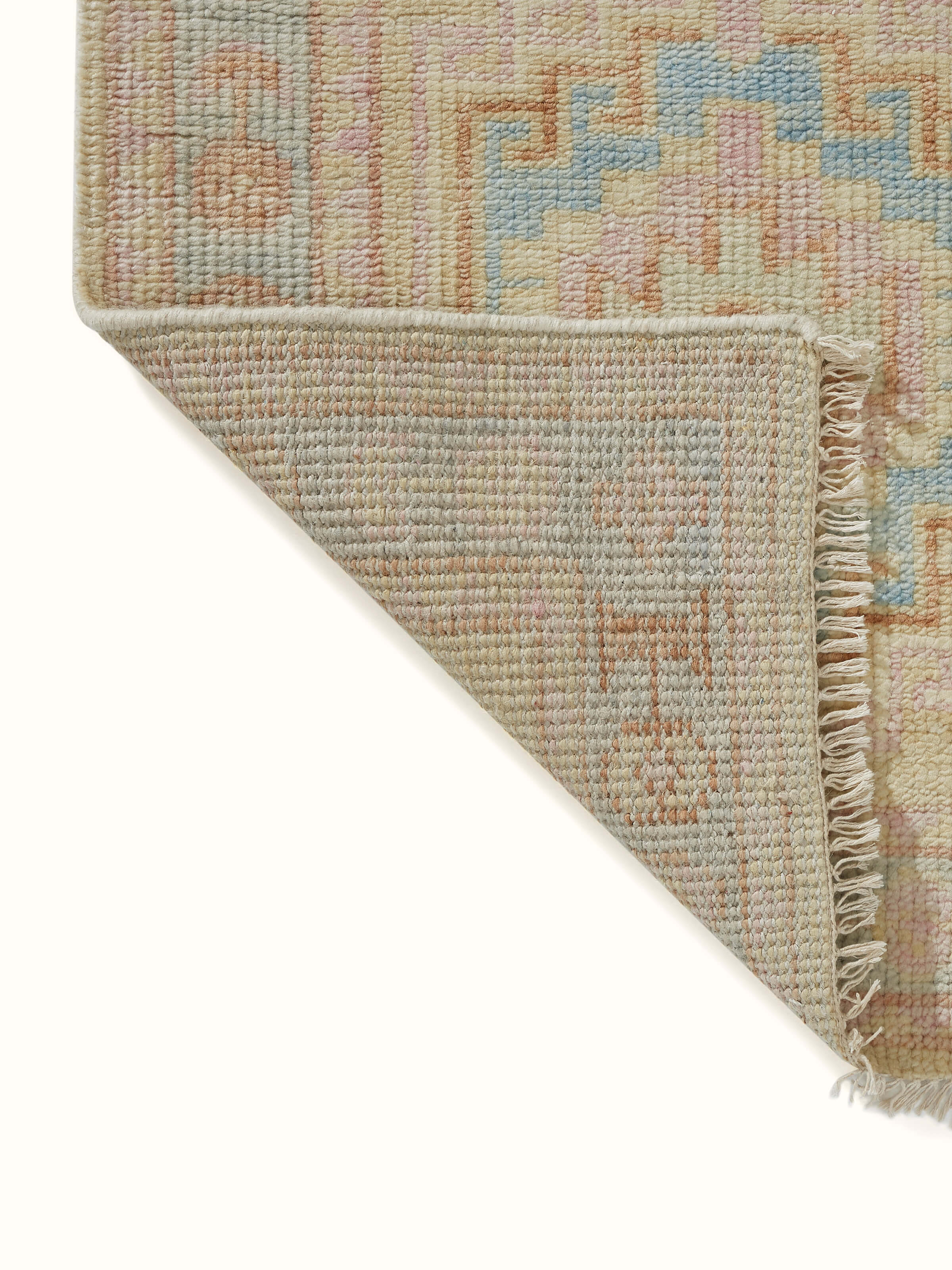 Back view of Traditional Khotan yellow Bhadohi wool hand-knotted rug showcasing fine weaving patterns