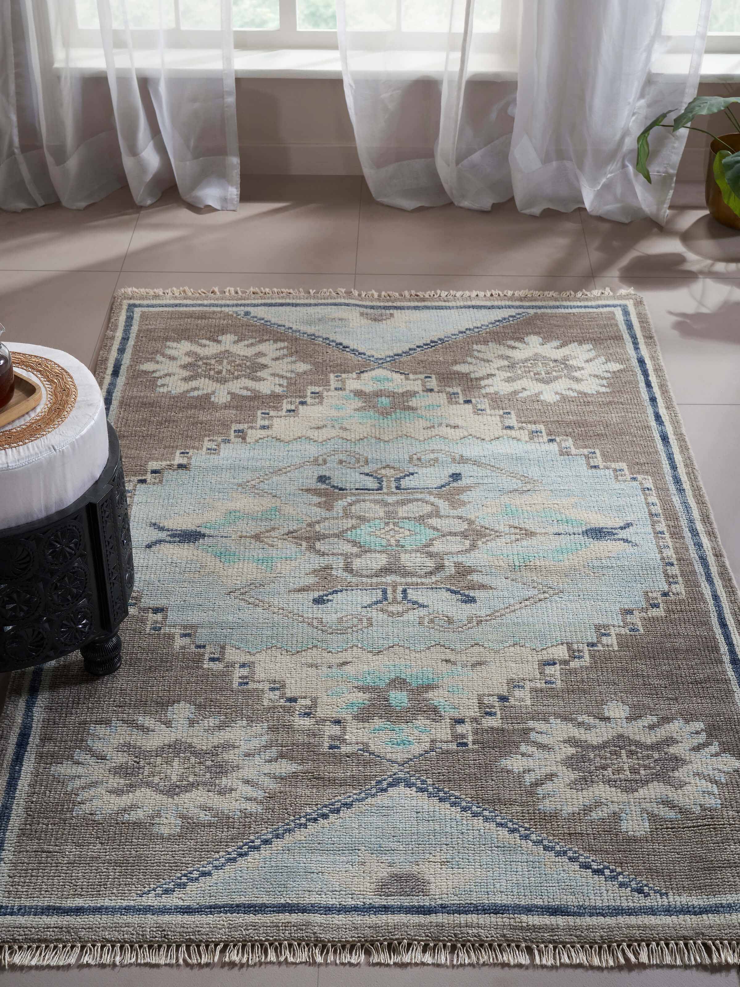 Close-up of the Traditional Oushak Grey Blue Bhadohi Wool Hand-Knotted Rug, showcasing the texture and craftsmanship.