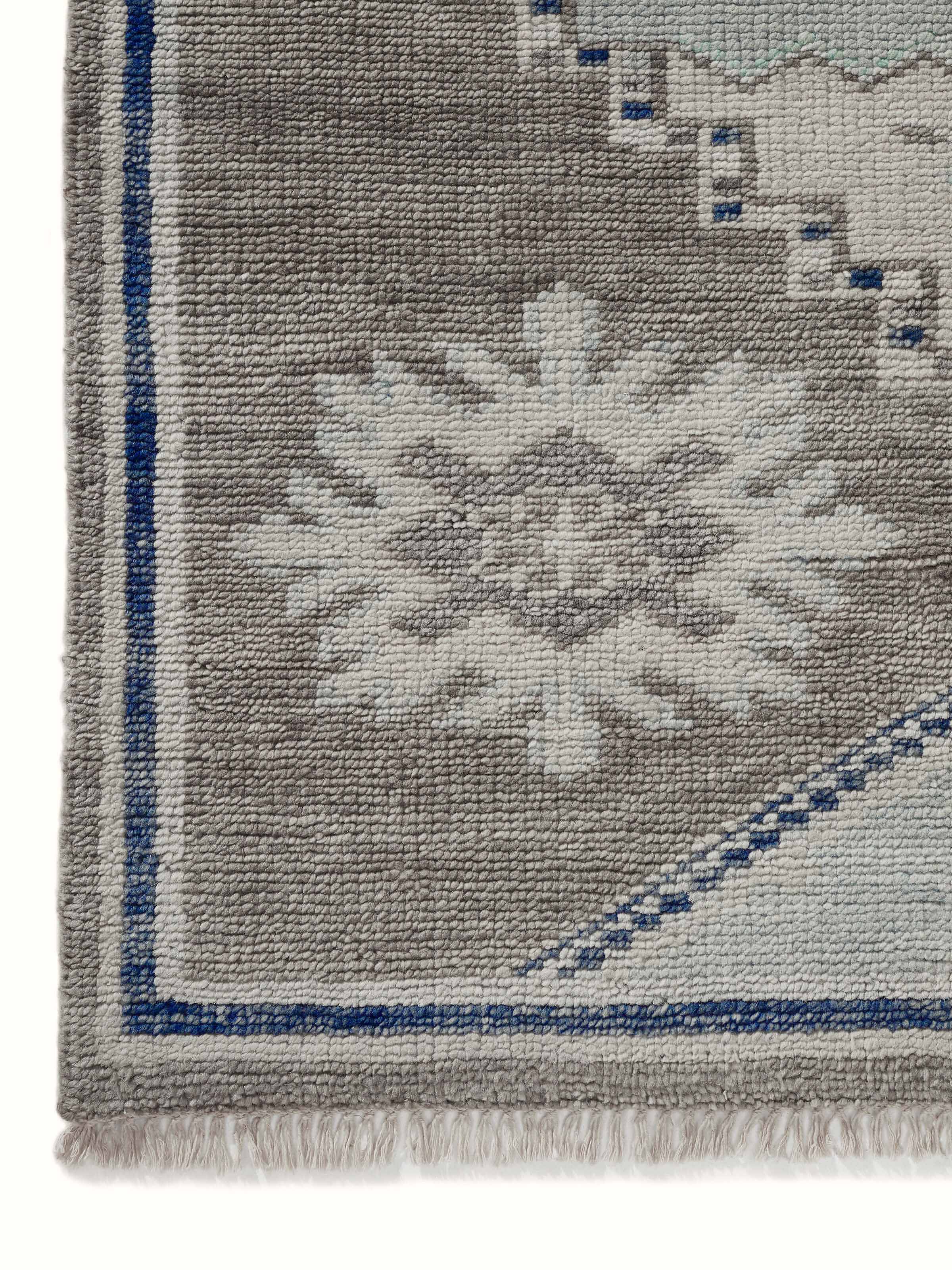Close-up of the Traditional Oushak Grey Blue Bhadohi Wool Hand-Knotted Rug, emphasizing the fine wool texture and detailed design.