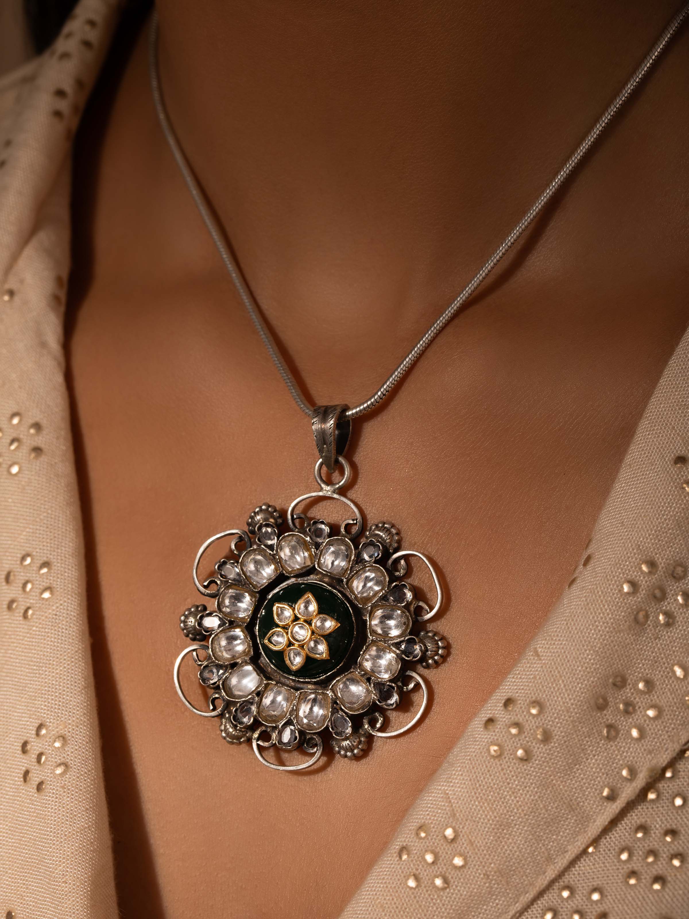 Close-up of Silver Smithing Pendant highlighting its intricate details and elegant silver finish.