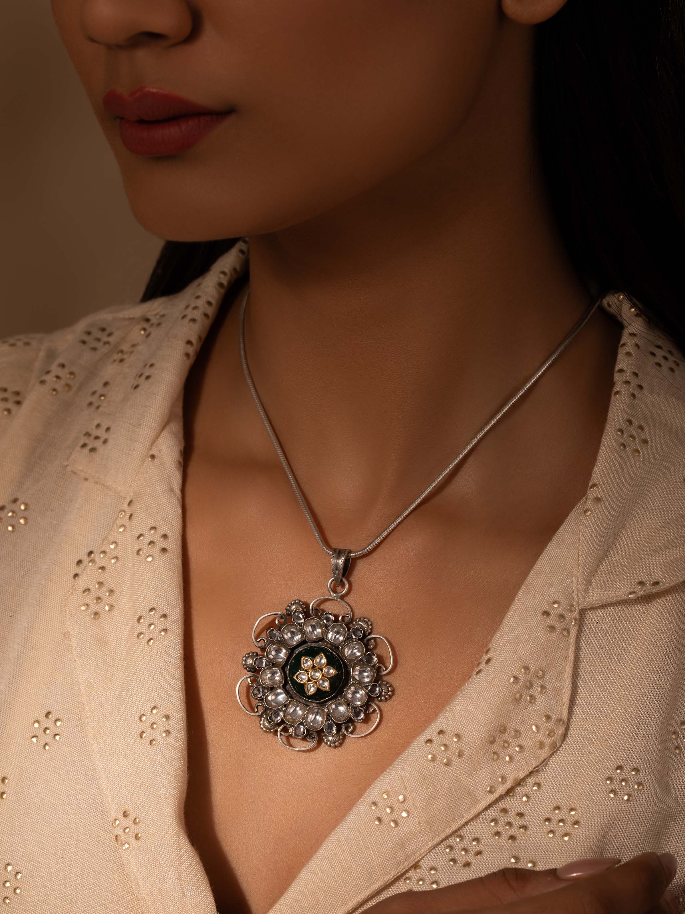 Side view of Silver Smithing Pendant emphasizing its sleek lines and fine craftsmanship.