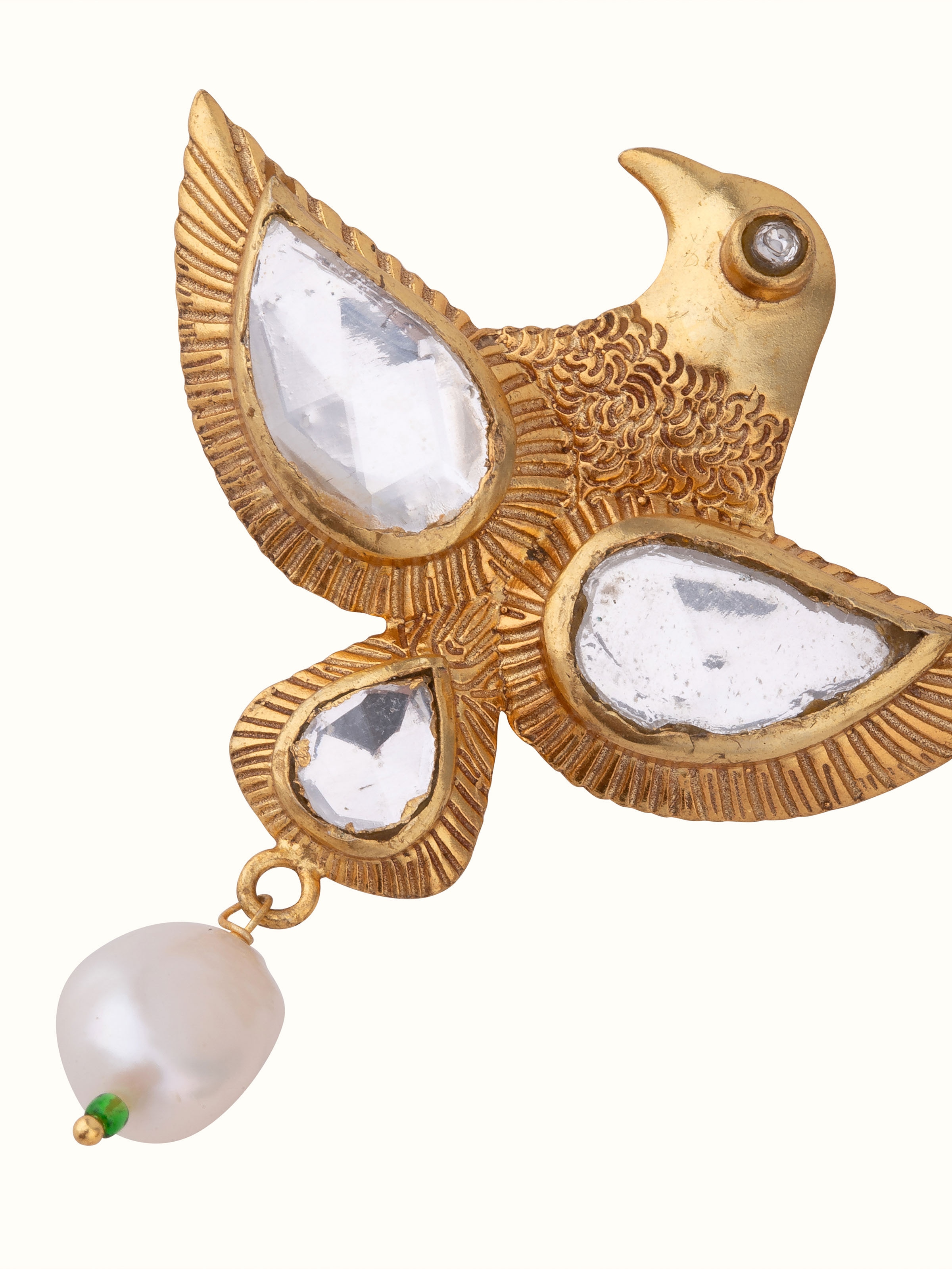 Close-up view of Silver Smithing brooch pin highlighting its elegant curve and textured surface.