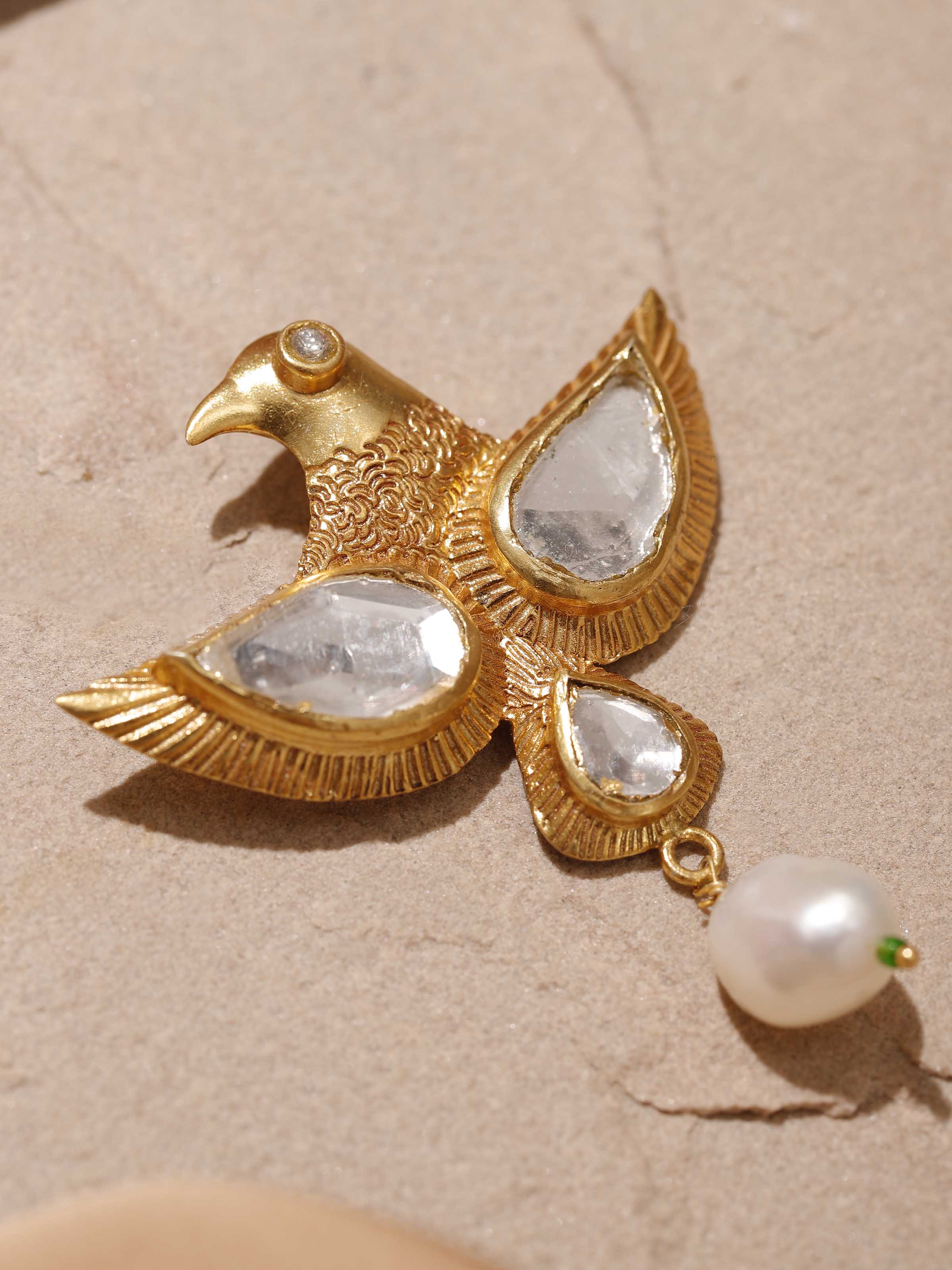 Detailed side view of Silver Smithing brooch pin showing its hammered texture and curved form.