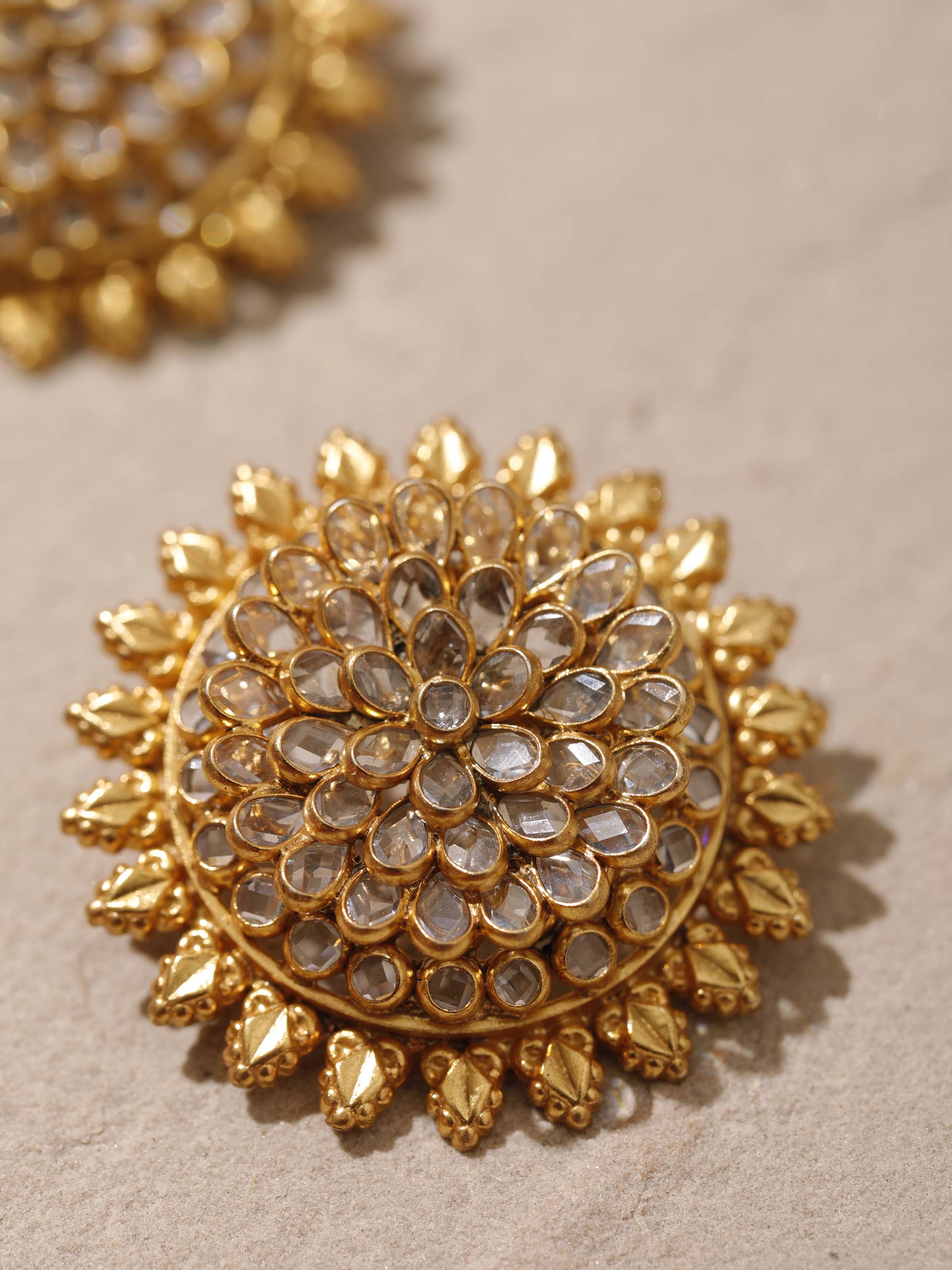 Detailed close-up of silver smithing stud earrings emphasizing their smooth finish and fine craftsmanship