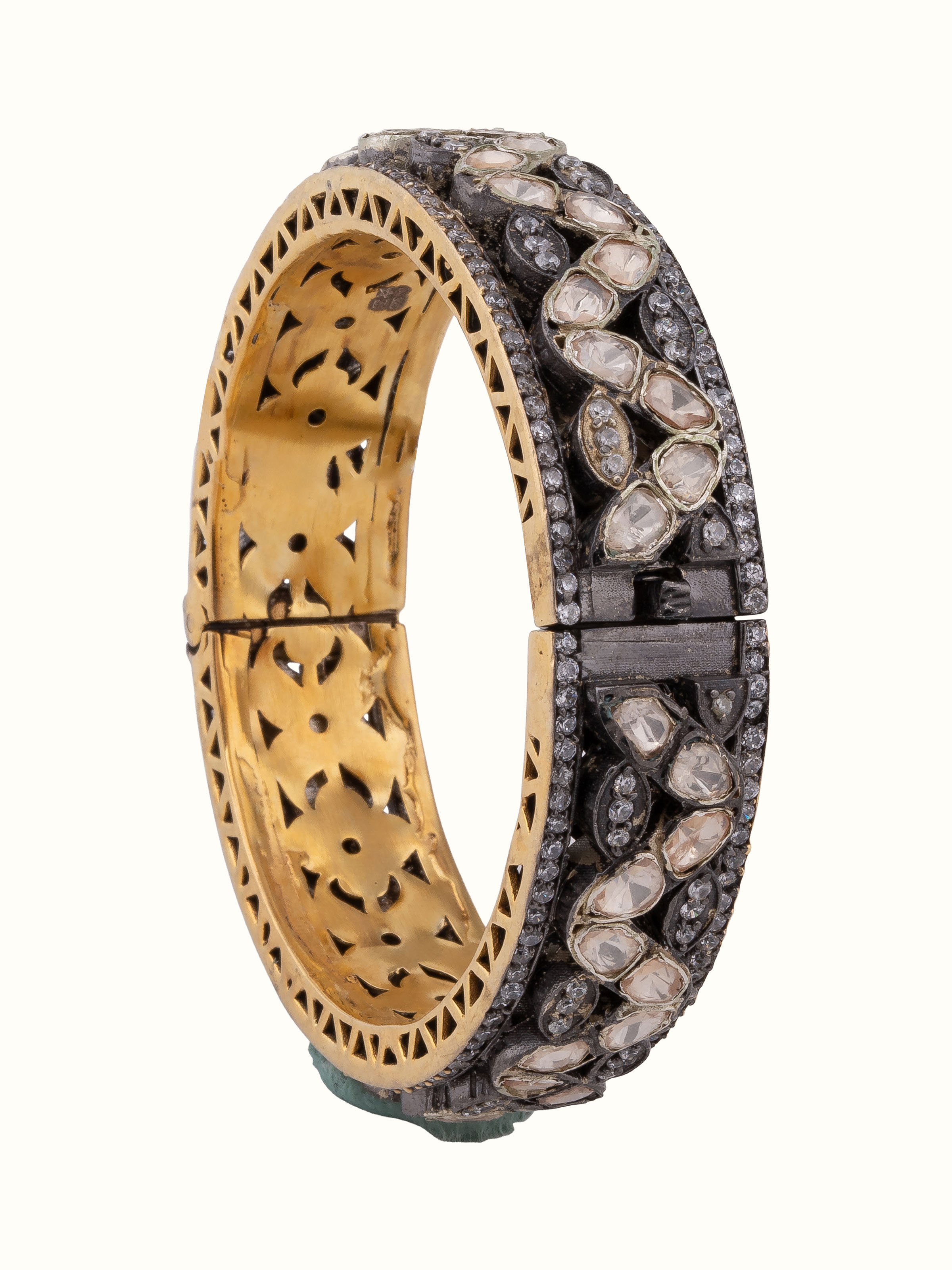 Front view of silversmithing bangle with elegant metalwork and refined finish.