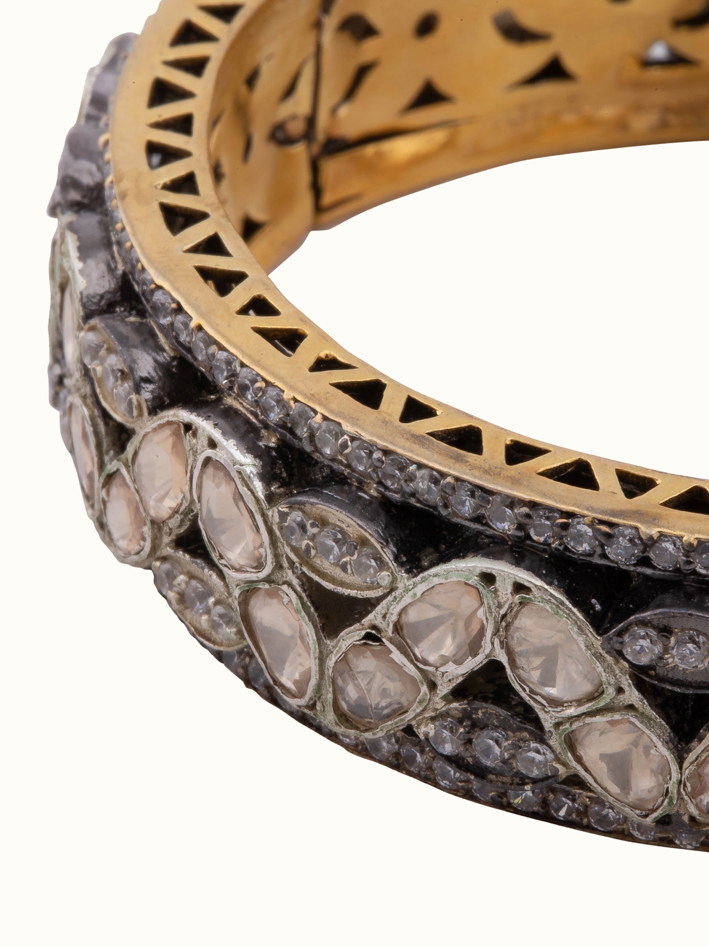 Side view of silversmithing bangle highlighting detailed craftsmanship.