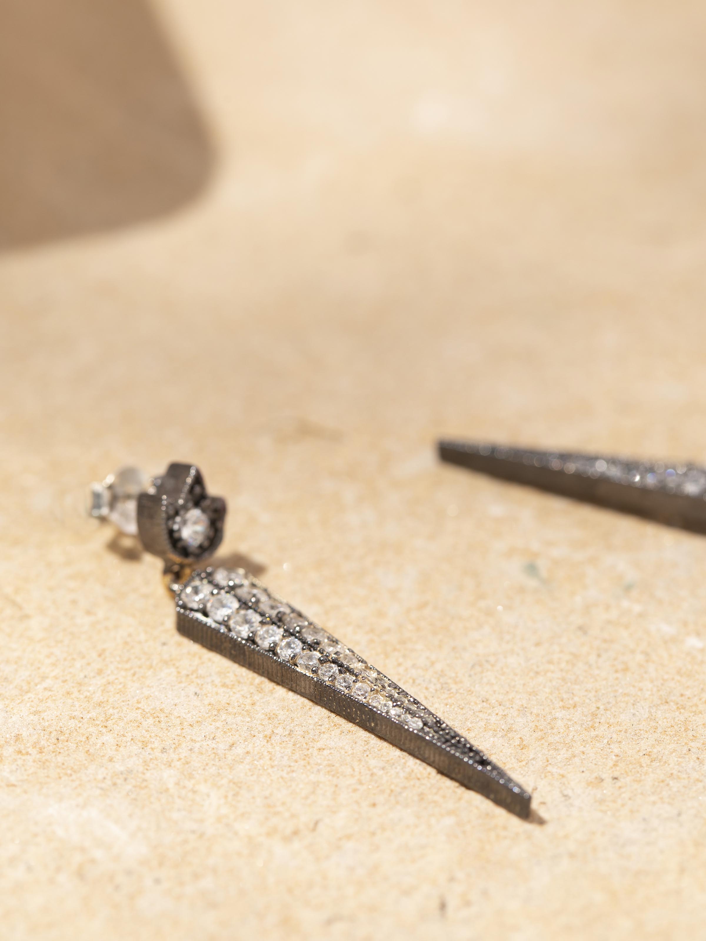 Silver Smithing Collar Necklace in natural light highlighting its elegant form.