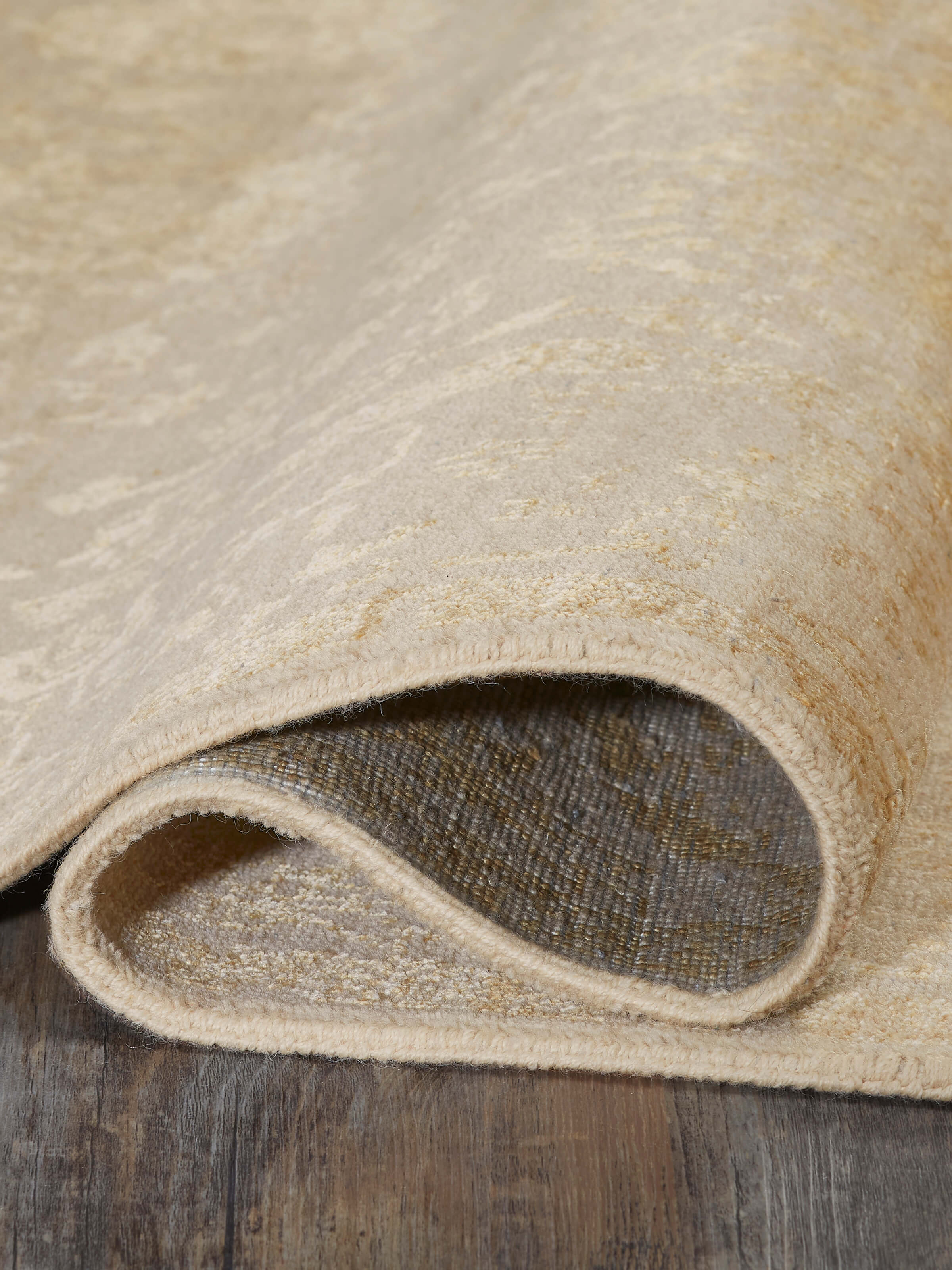 Side view of the transitional gold Agra rug showing the depth and richness of its wool and viscose blend