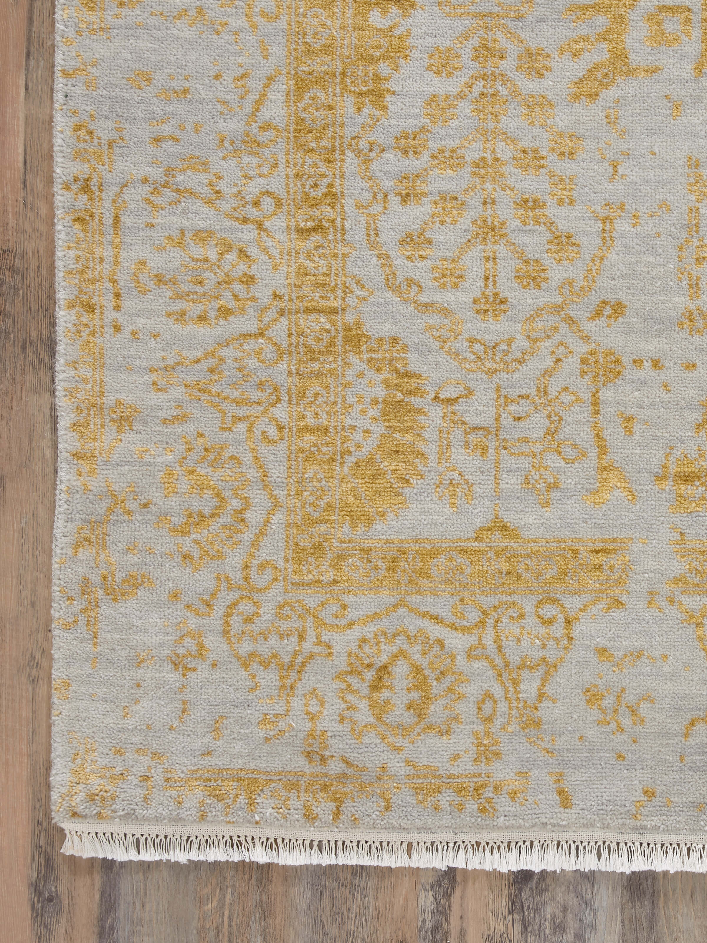 Side view of Distressed Transitional Grey Gold Agra Wool & Viscose Hand-Knotted Rug, showing its texture and edge details.