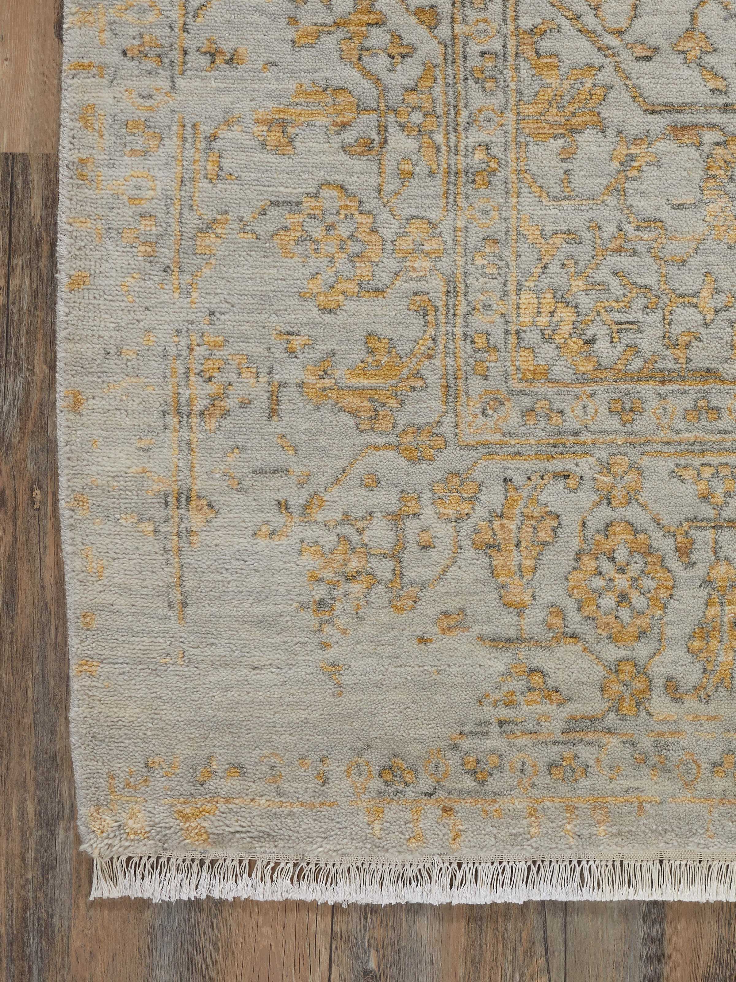 Detailed view of the distressed transitional grey Agra wool & viscose hand-knotted rug, showing its texture and color variation
