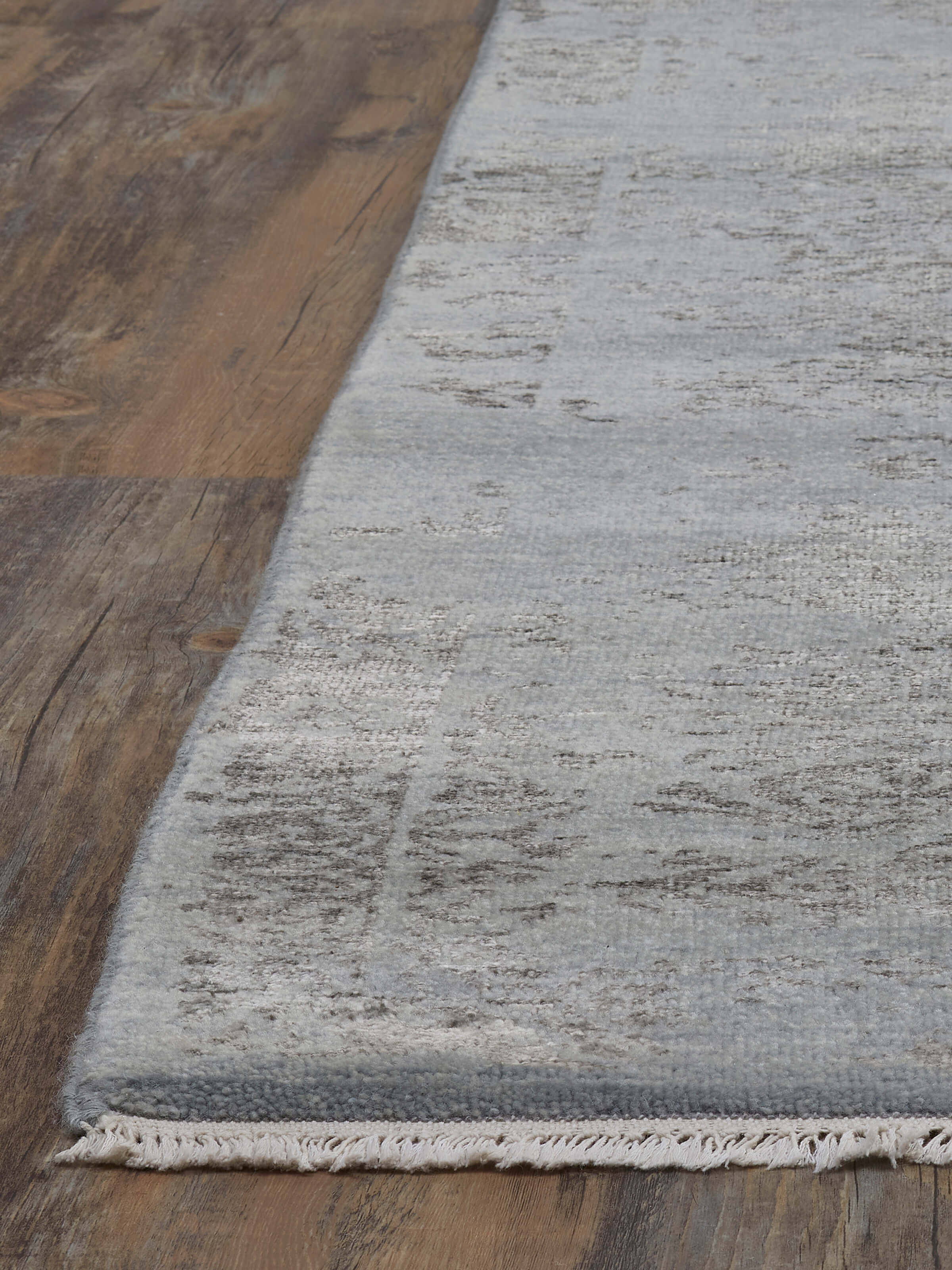 Front view of Distressed Transitional Blue Charcoal Agra Wool & Viscose Hand-Knotted Rug showcasing its distressed pattern.