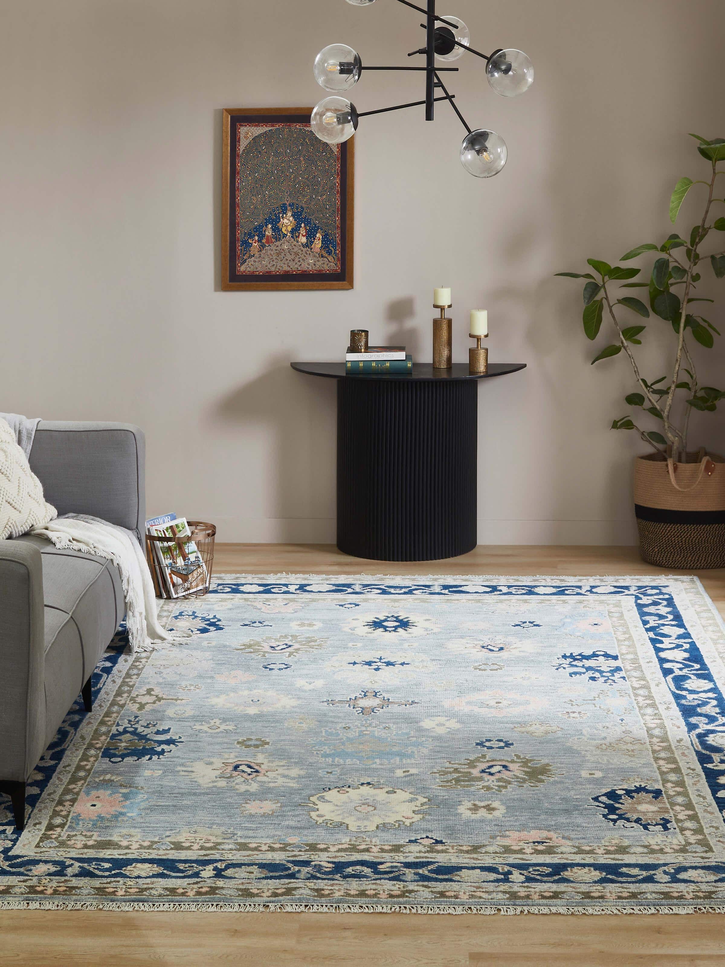 Close-up of Oushak traditional blue wool rug showing detailed hand-knotted craftsmanship and pattern.