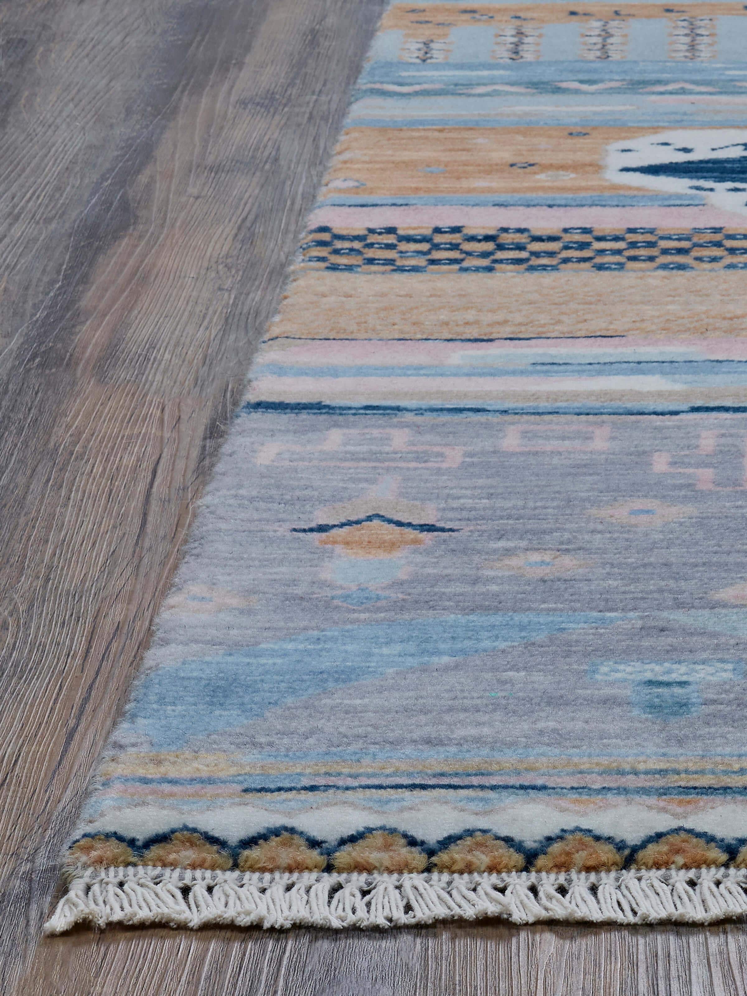Abstract patchwork blue Agra wool hand-knotted rug with a focus on the intricate patchwork patterns and wool texture.