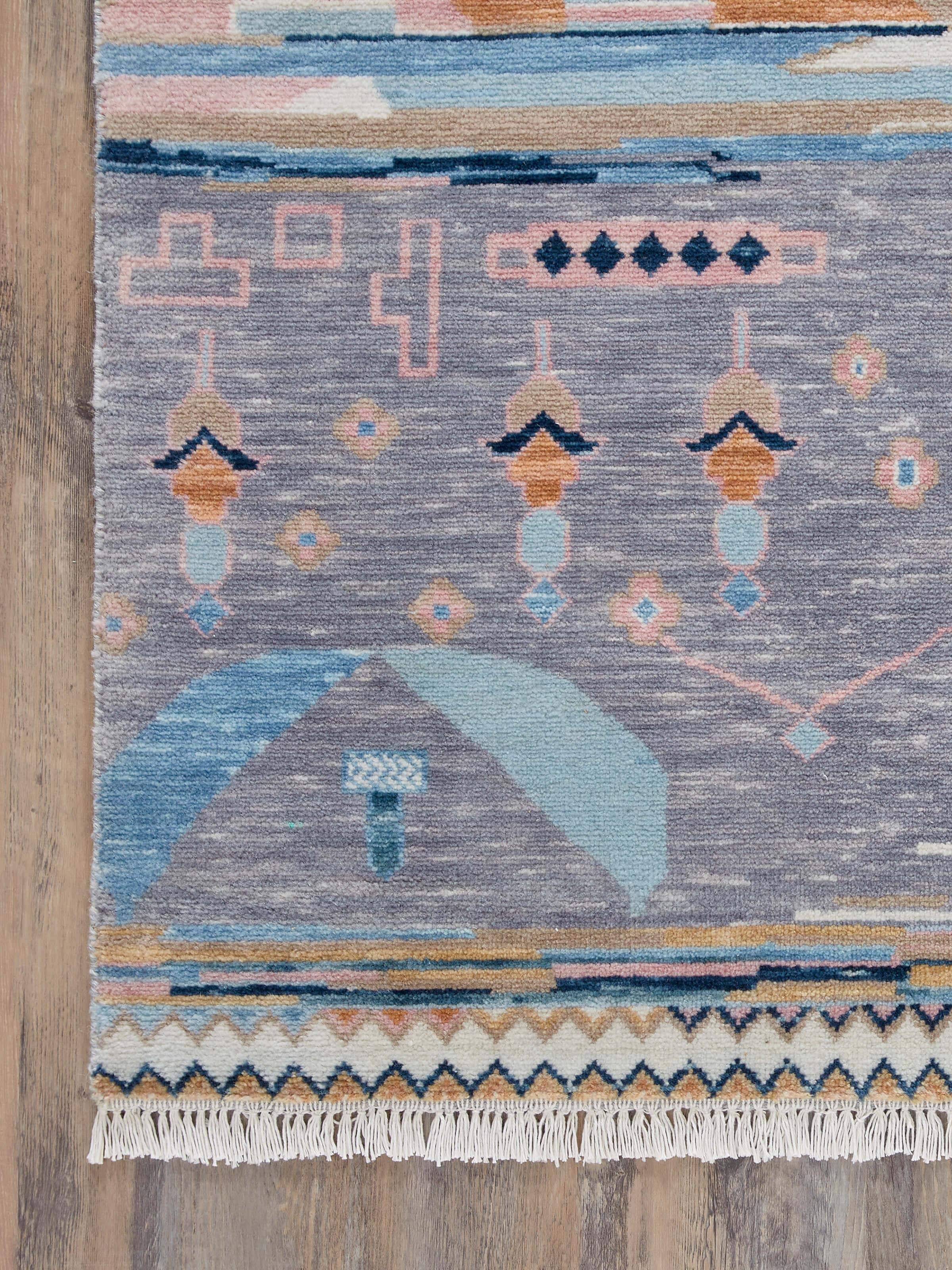 Detailed view of Abstract patchwork blue Agra wool hand-knotted rug, highlighting the unique blue patchwork design and hand-knotted details.