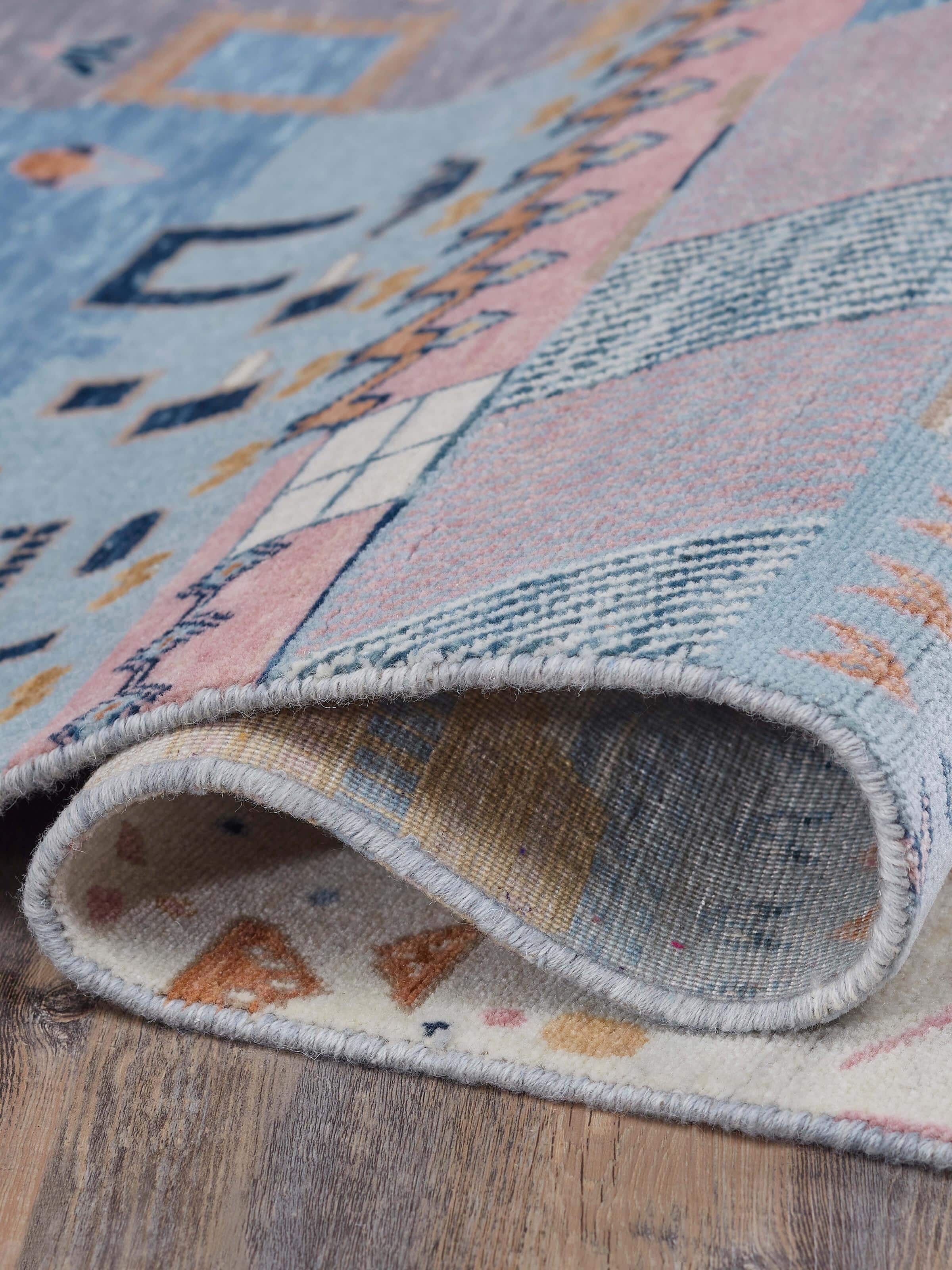 Abstract patchwork blue Agra wool hand-knotted rug displayed with emphasis on the full patchwork design and wool texture.