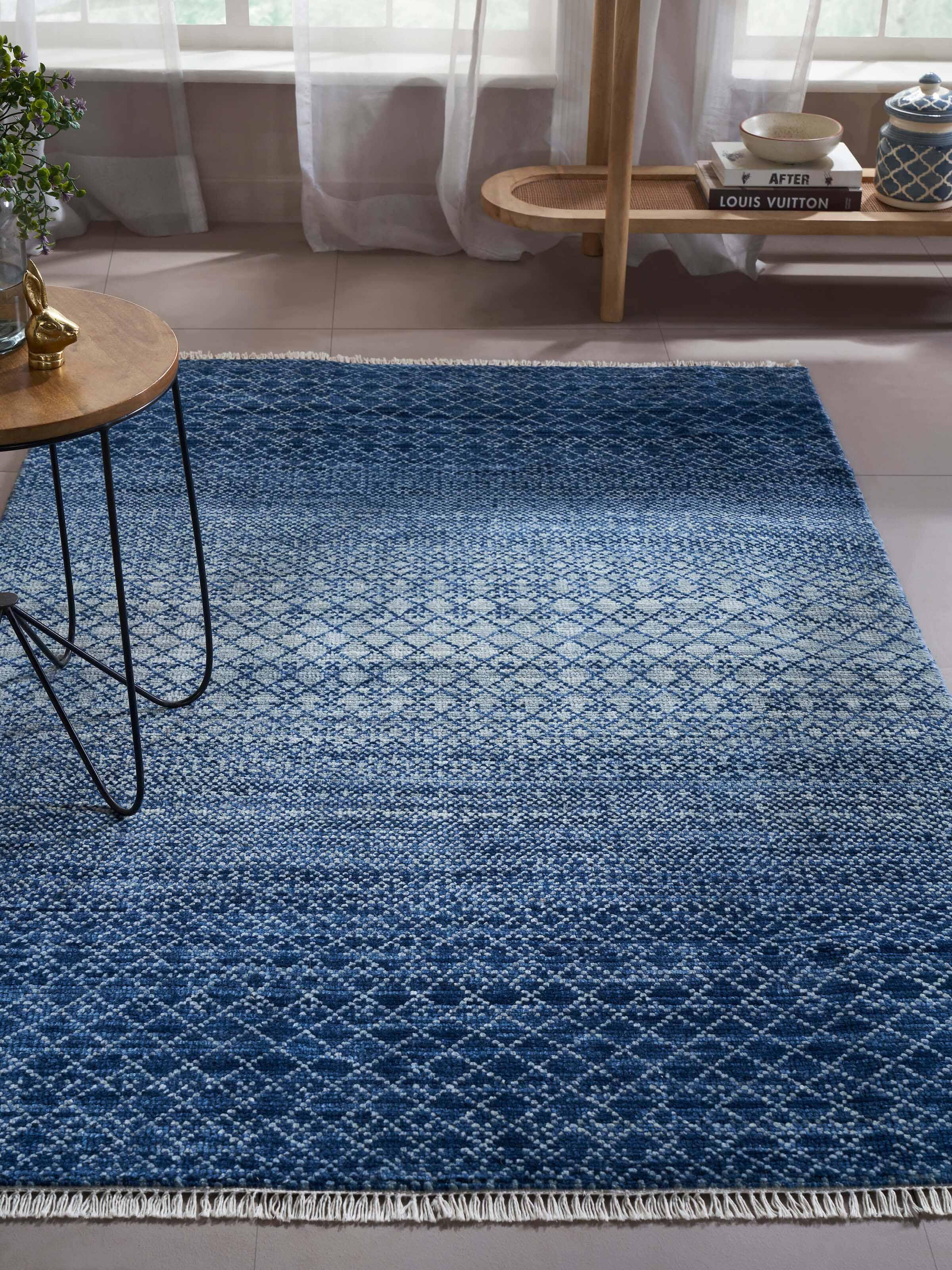 Ombre grass blue Agra wool hand-knotted rug with a close-up view highlighting its intricate patterns.