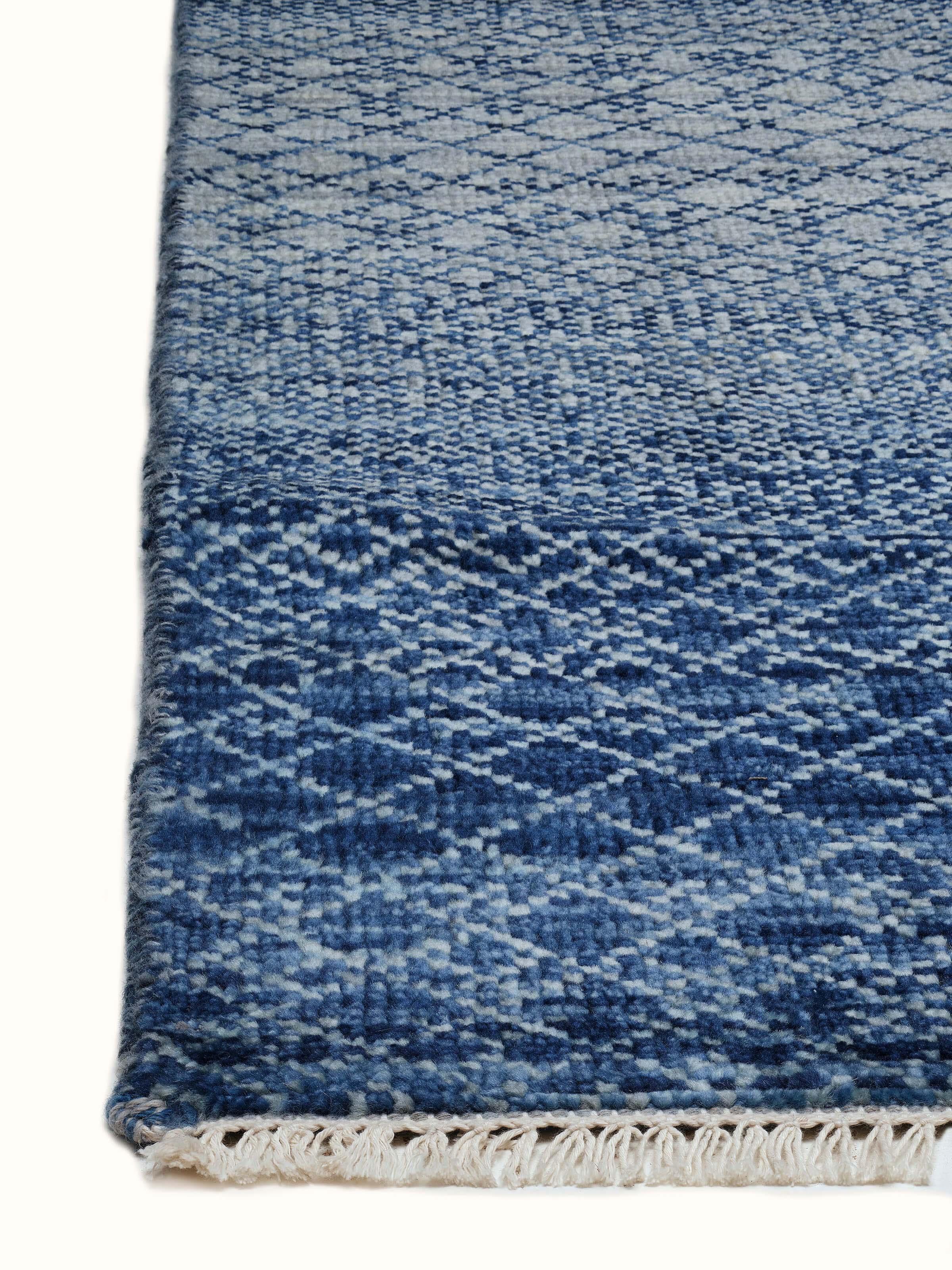 Ombre grass blue Agra wool hand-knotted rug featuring a detailed view of its rich texture and design.