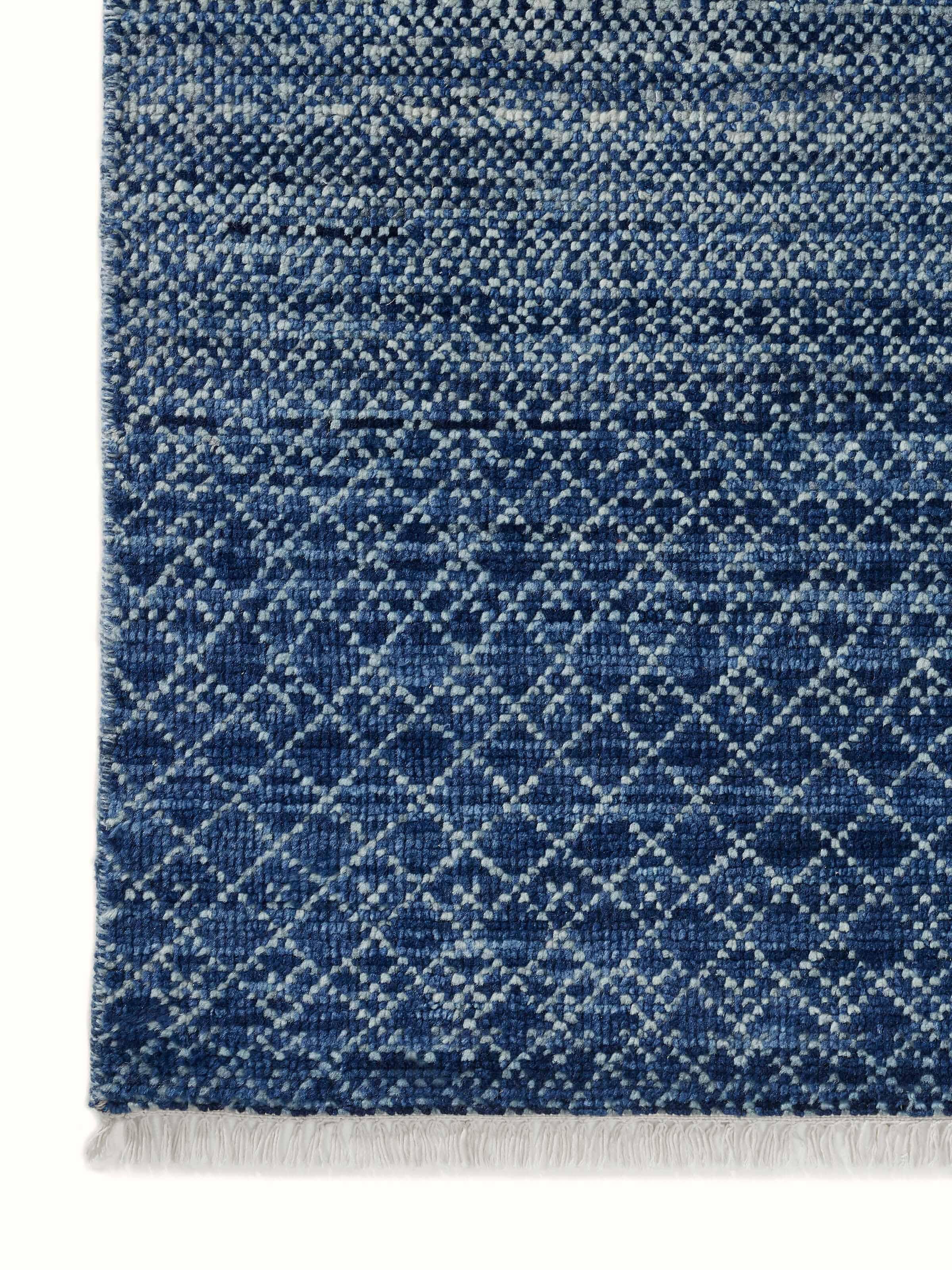 Ombre grass blue Agra wool hand-knotted rug emphasizing its vibrant blue hues and wool texture.