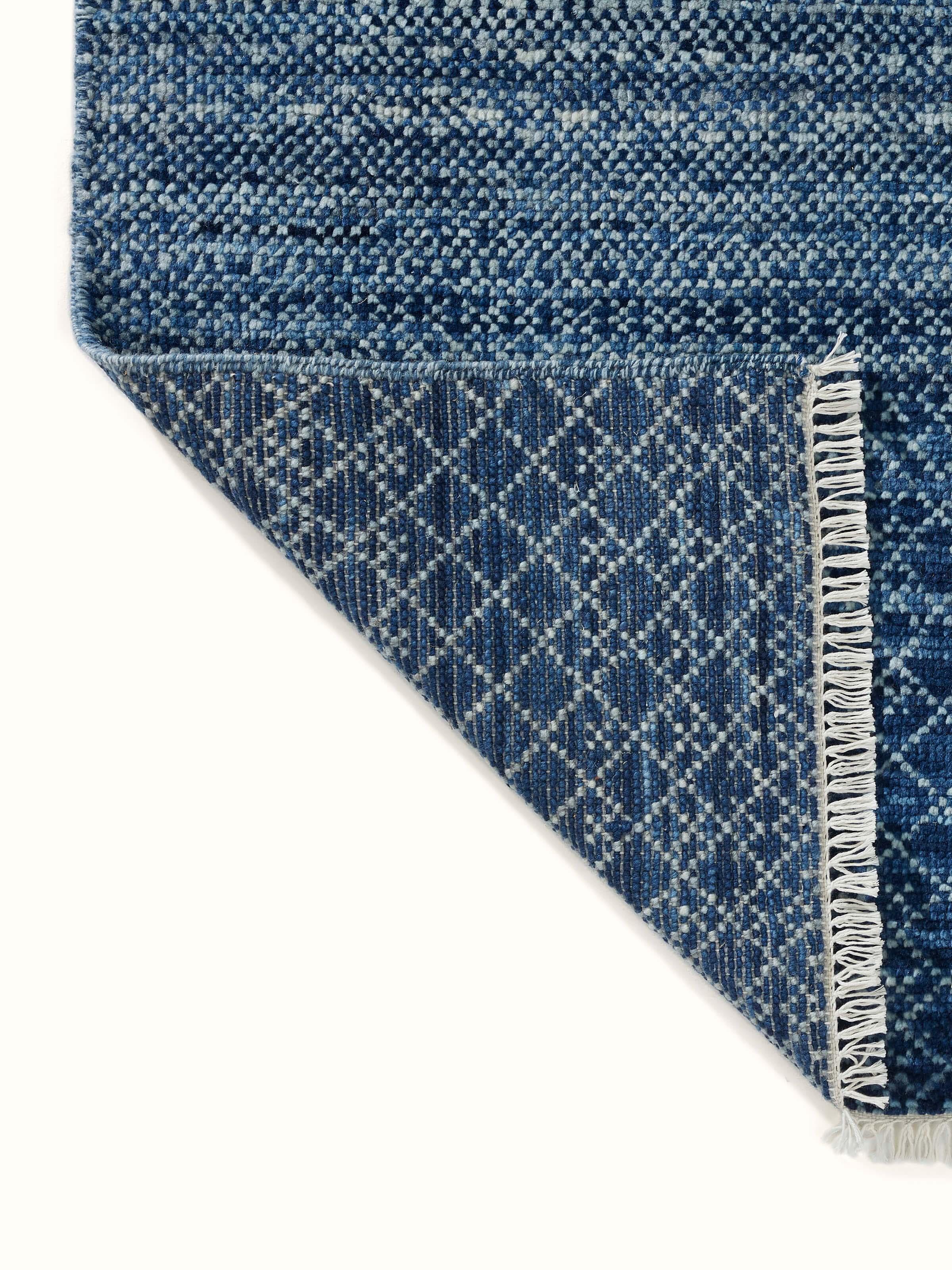 Ombre grass blue Agra wool hand-knotted rug from a different angle highlighting its overall design.