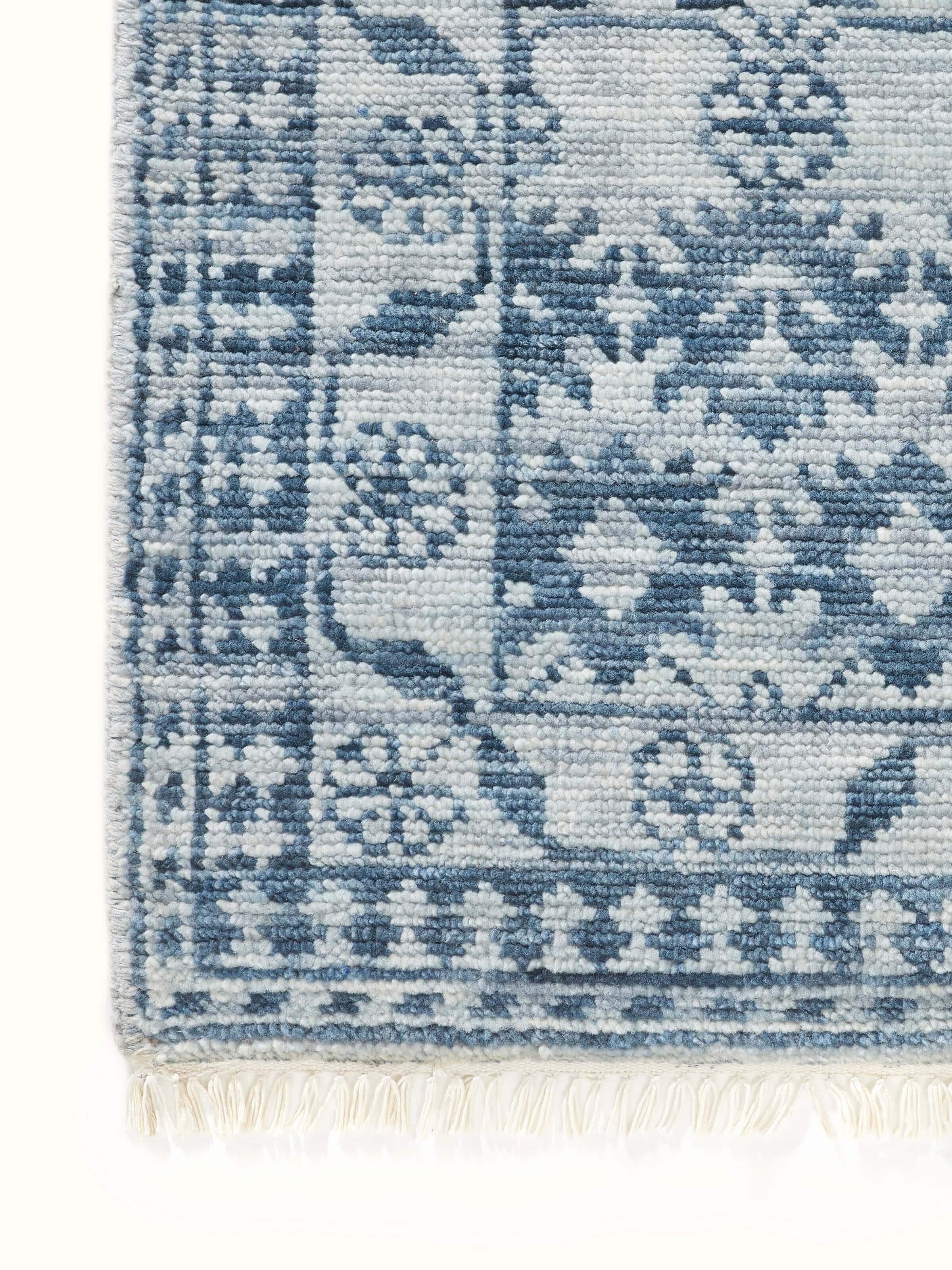 Angled view of the Ziegler Traditional Blue Agra Wool Hand-Knotted Runner, emphasizing the rug's rich blue color and texture.