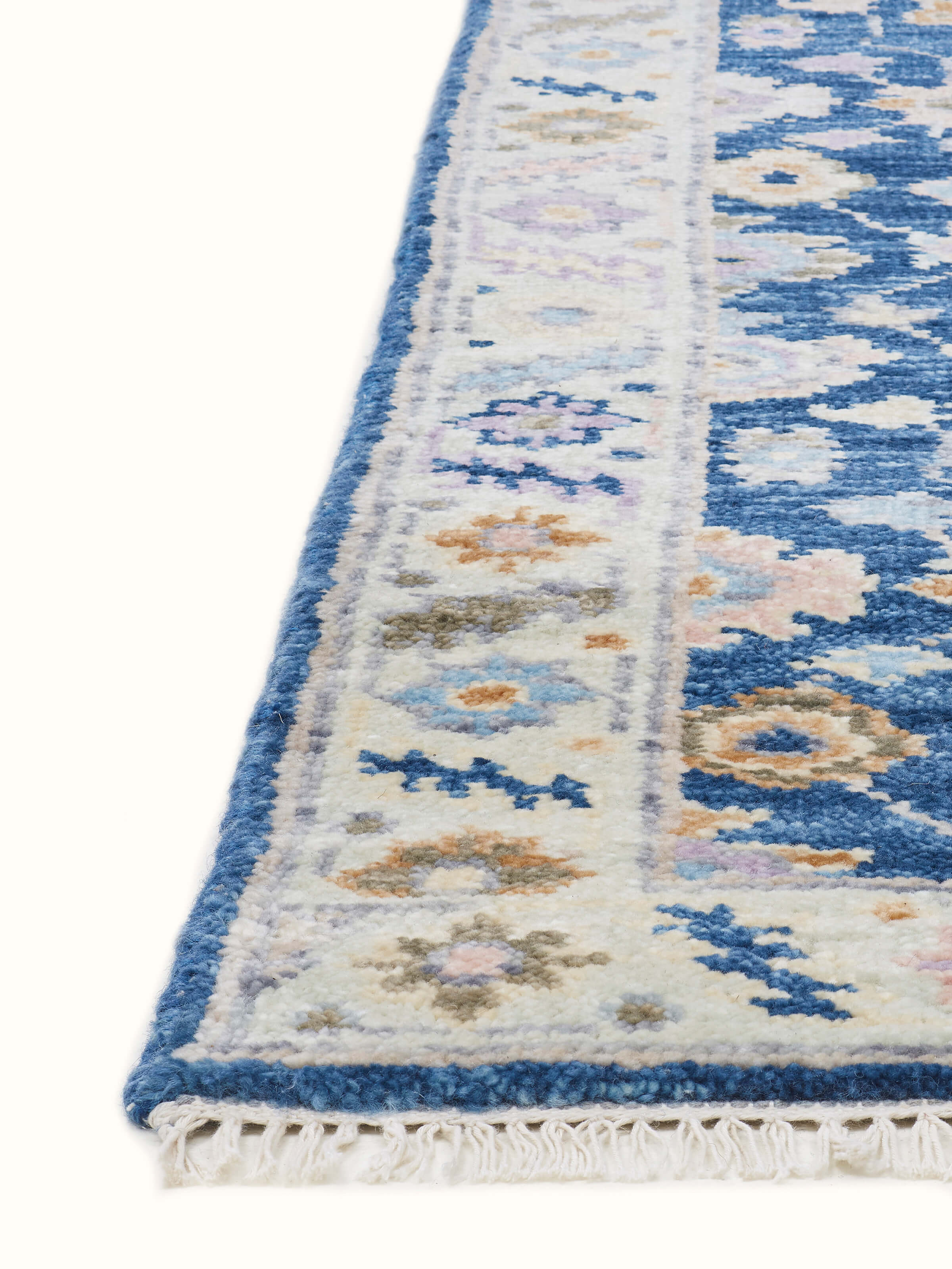 Angle view of Ziegler traditional blue chobi Agra wool hand-knotted runner with emphasis on texture and design
