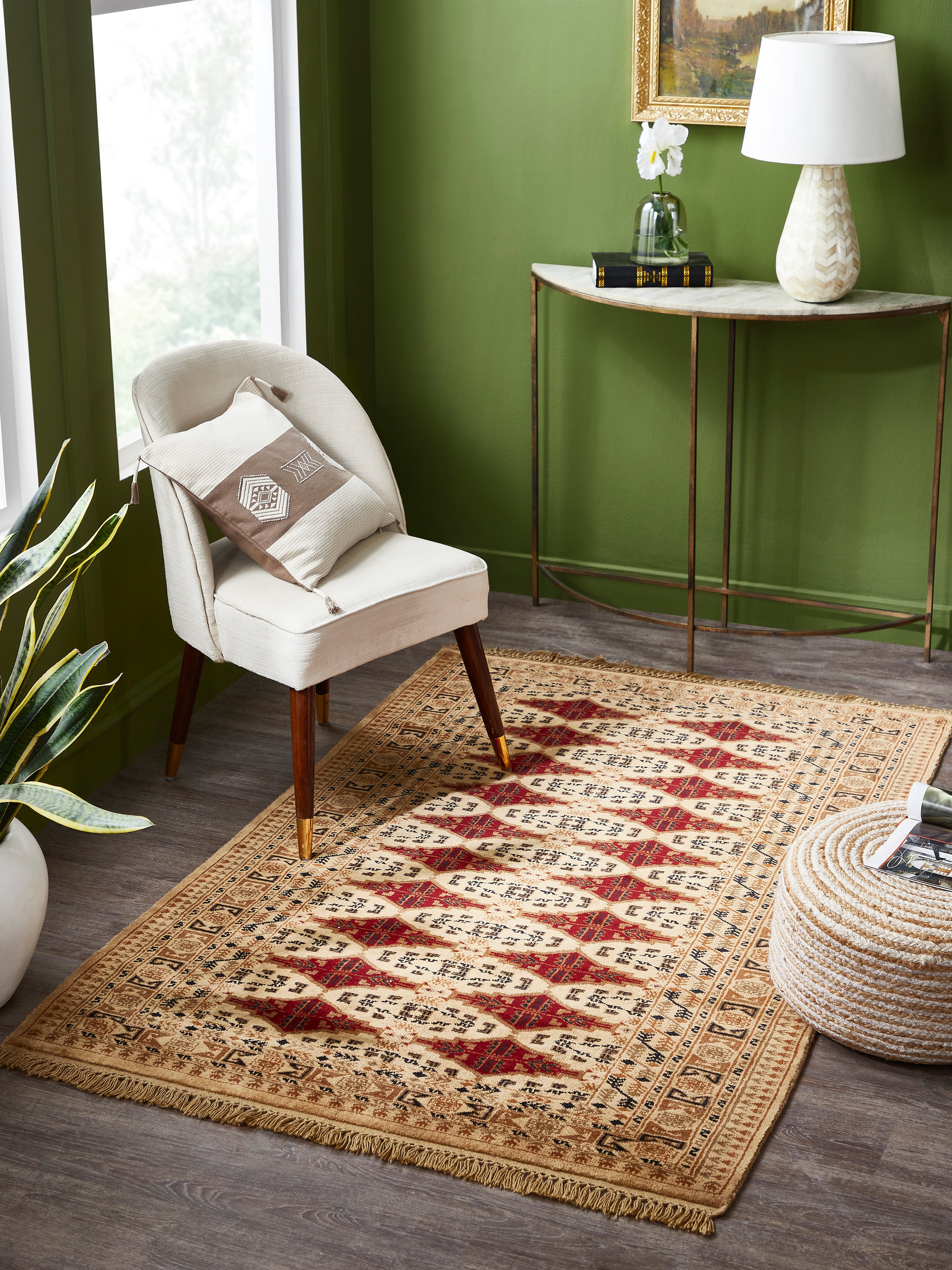 Traditional beige and rust Bukhara Gwalior wool hand-knotted rug styled in room