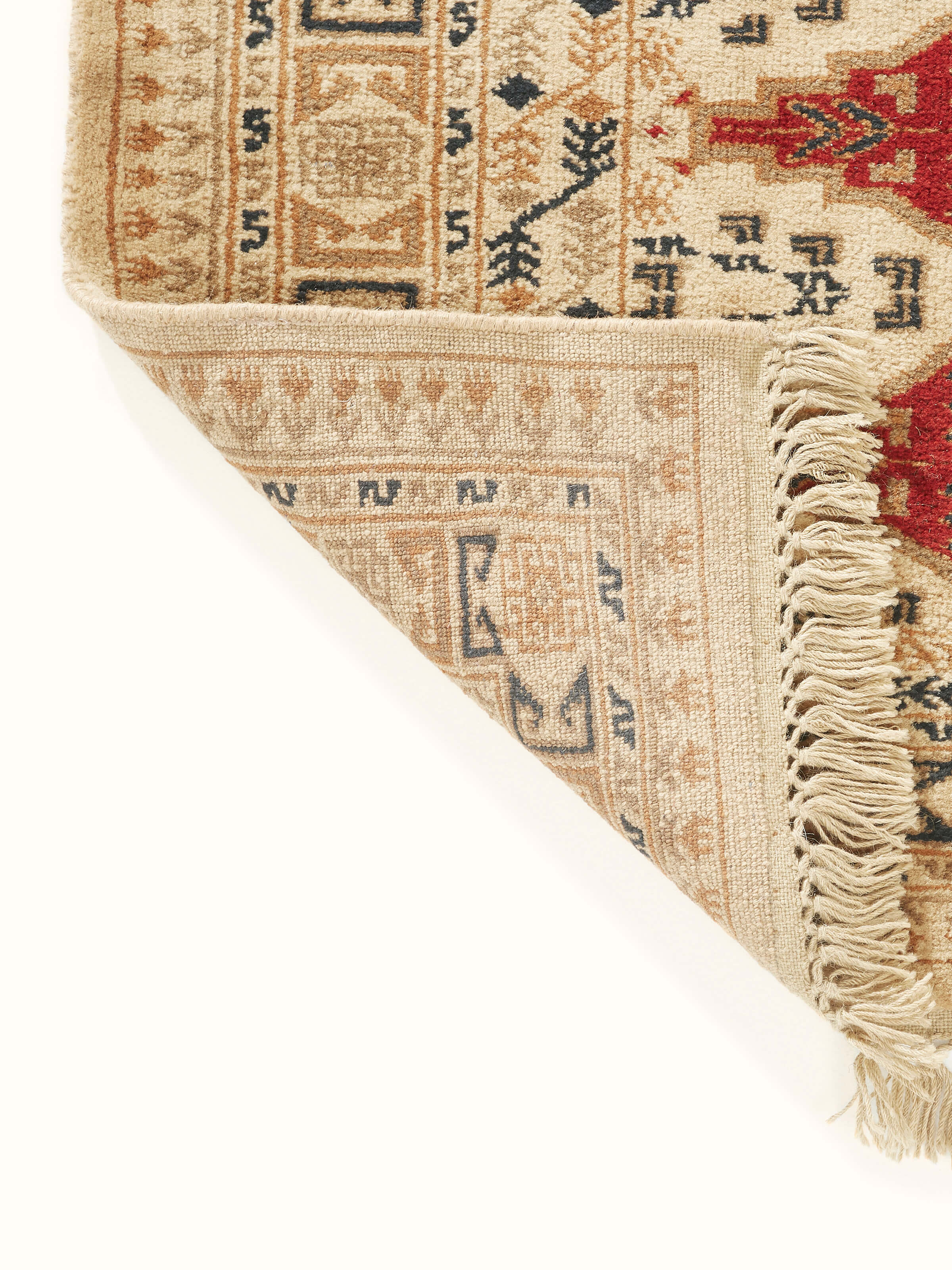 Detailed view of Traditional Bukhara beige rust Gwalior wool hand-knotted rug, focusing on the intricate design and rich hues