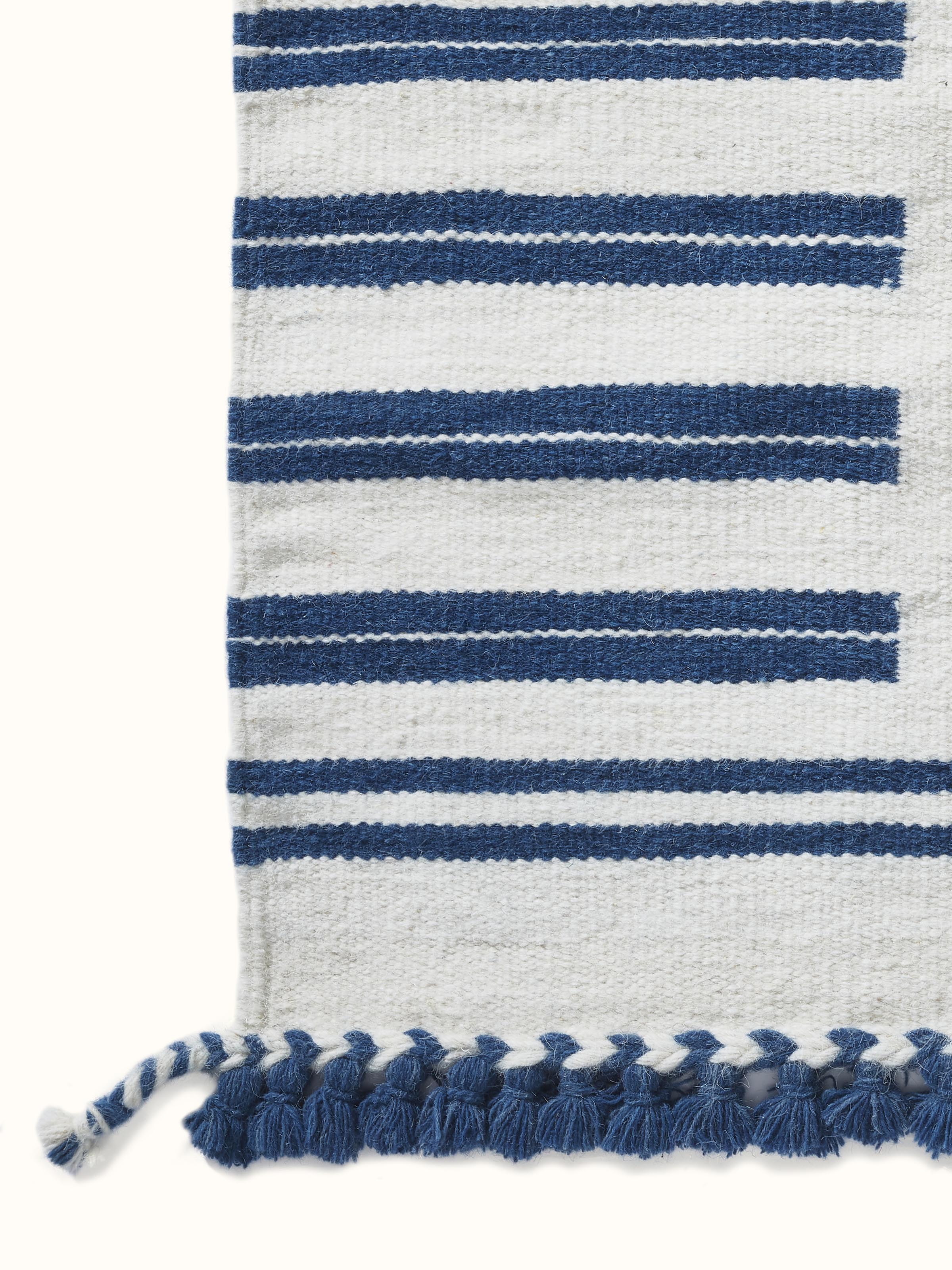 Geo border ivory blue Gujarat wool & cotton panja dhurrie kharad (4x6 ft) displayed to show its full pattern and texture.