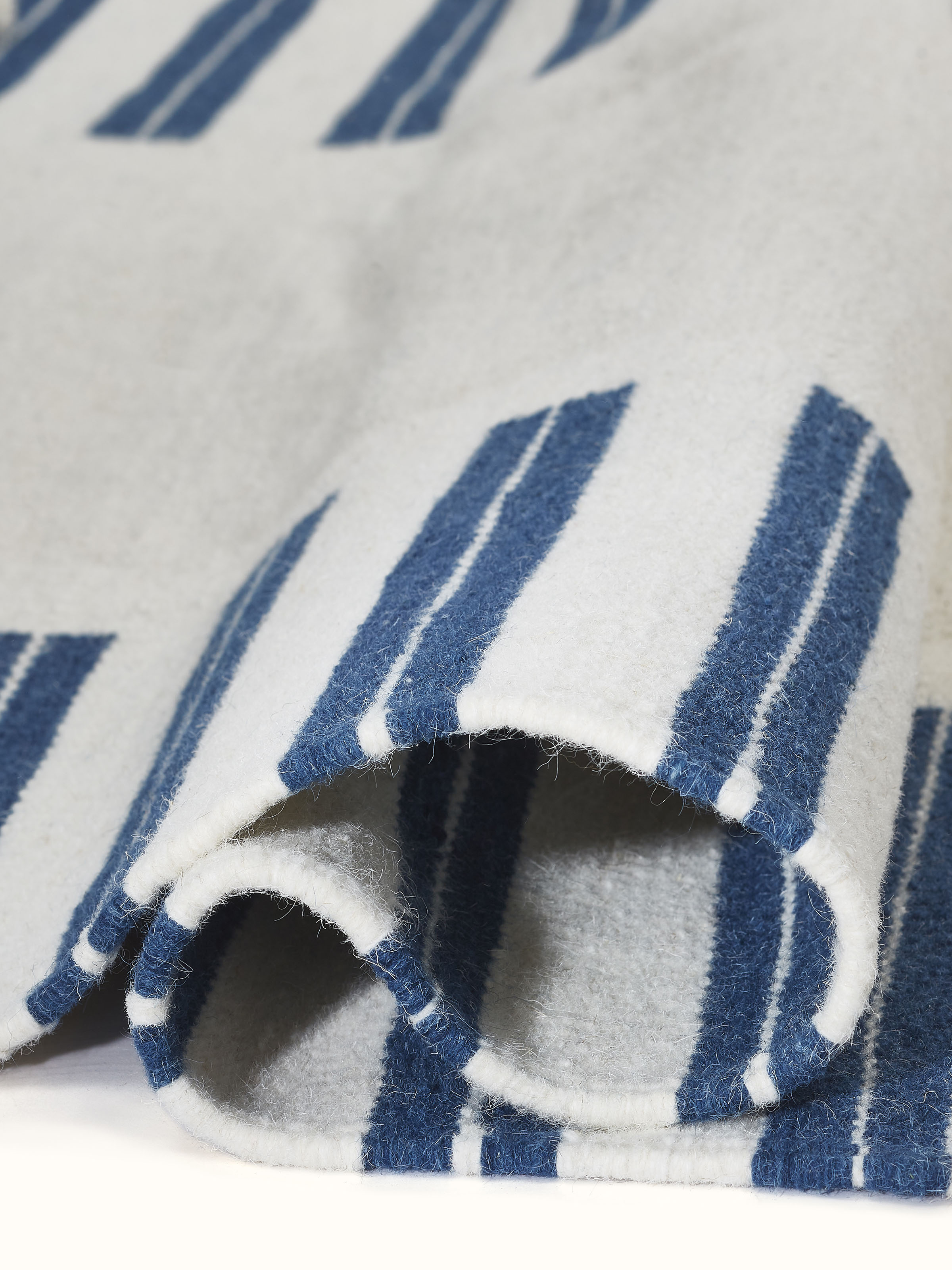 Geo border ivory blue Gujarat wool & cotton panja dhurrie kharad (4x6 ft) featuring a detailed view of the design and wool-cotton blend.