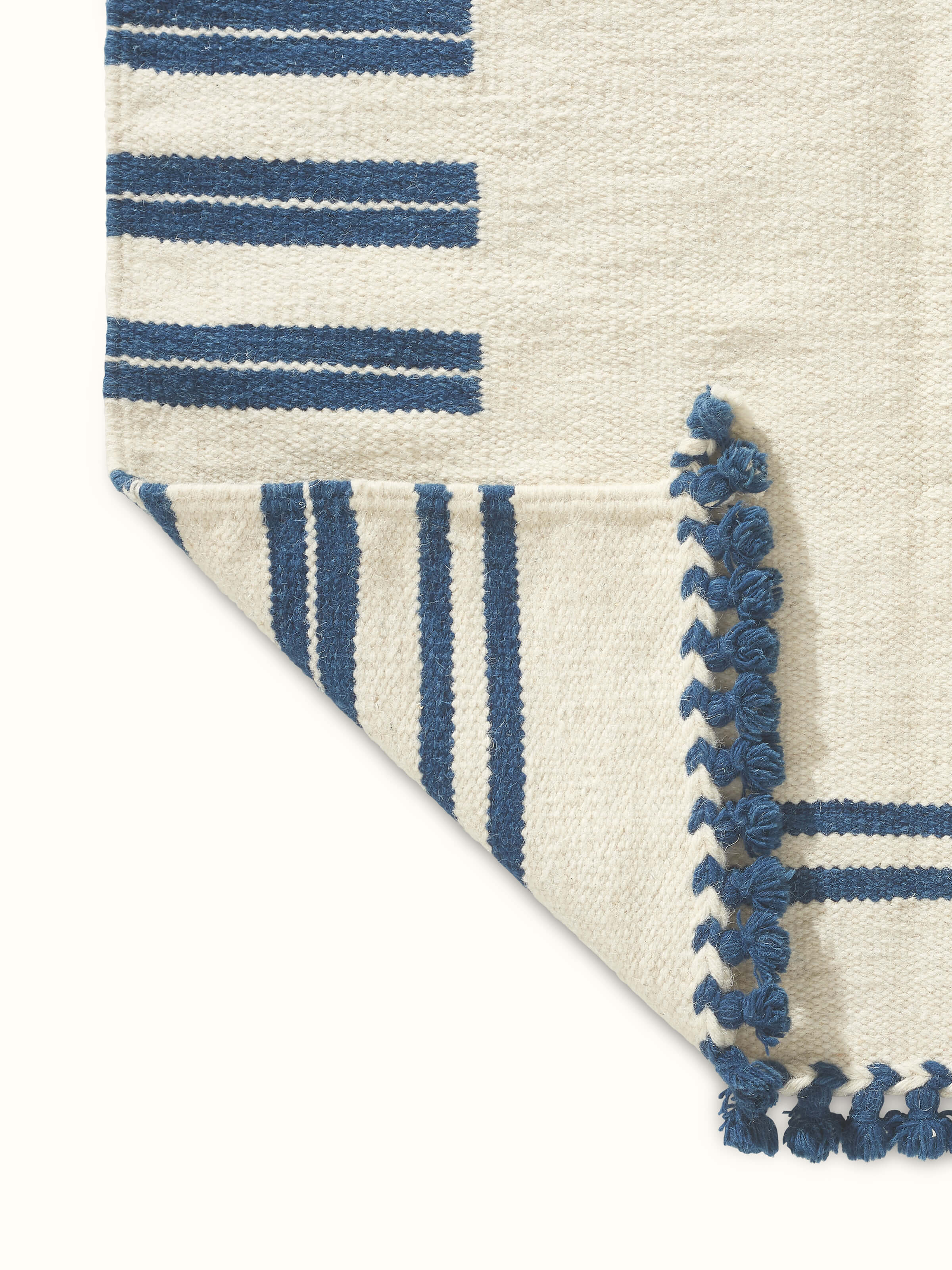 Full shot of Geo Border Ivory Blue Gujarat Wool & Cotton Panja Dhurrie (3x5 ft), demonstrating the overall design and natural fibers used.