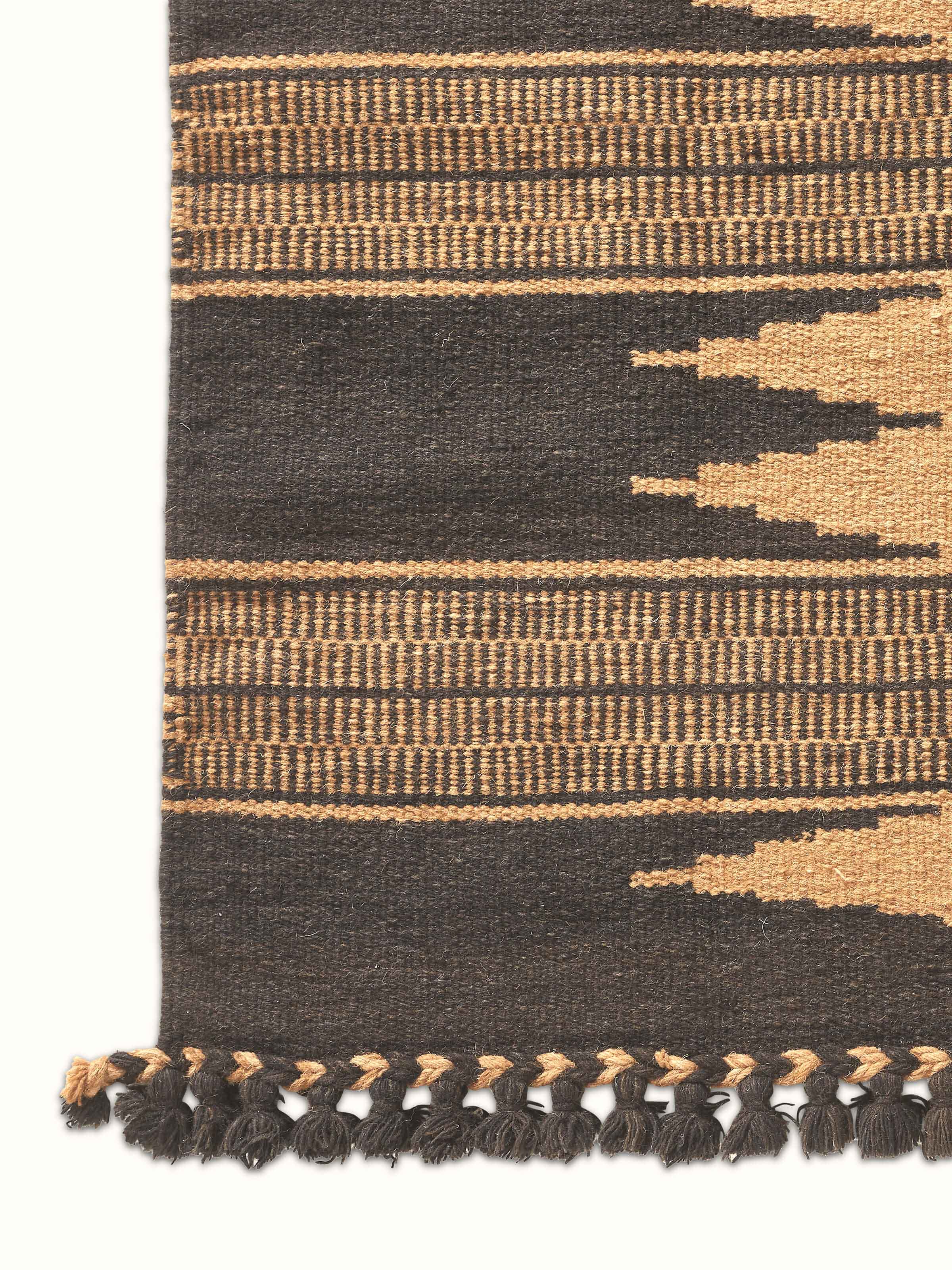 Close-up of the texture and design on Geo Diamonds dark brown Gujarat wool & cotton panja dhurrie