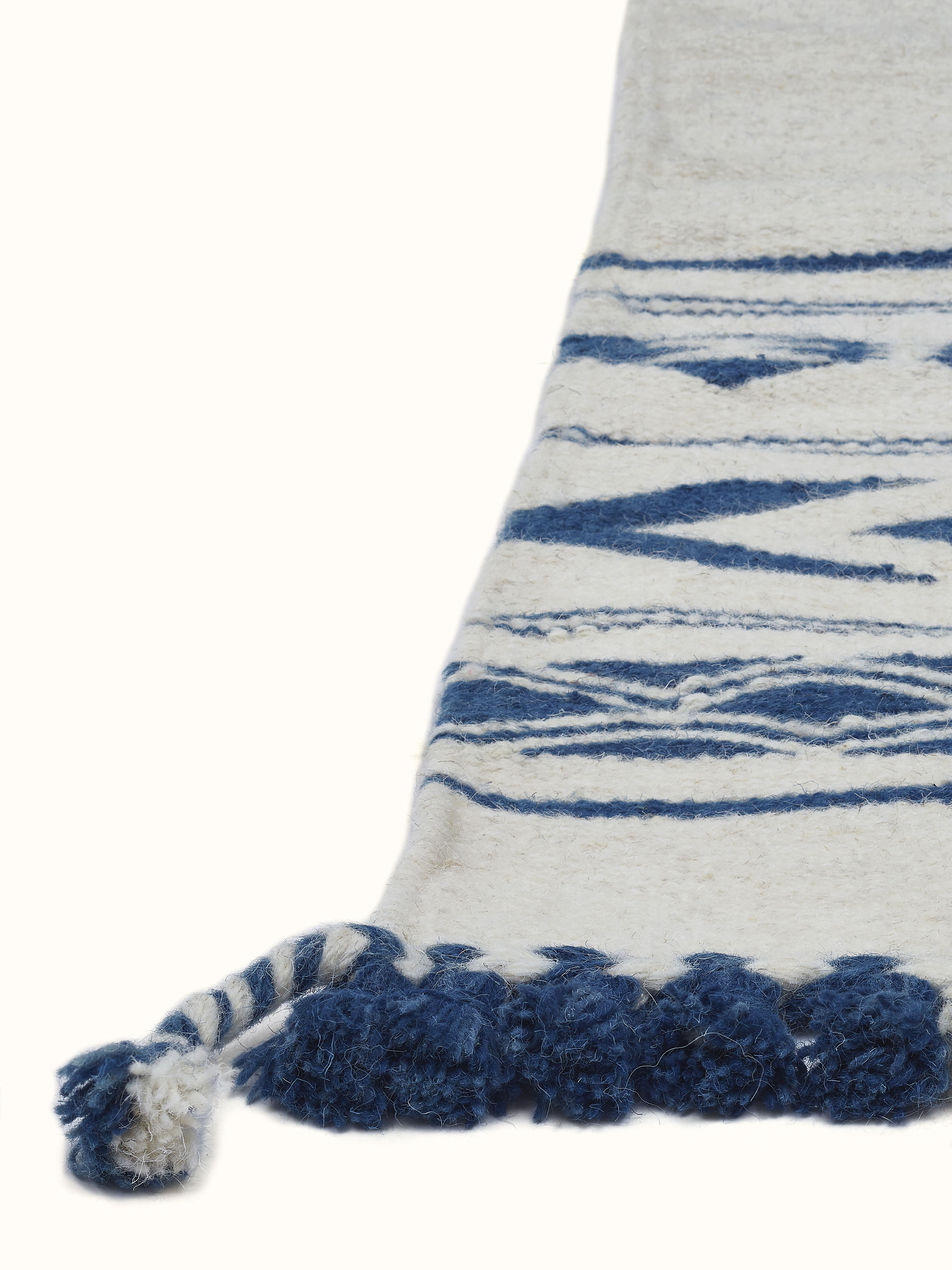 Traditional Geo Ivory Indigo Gujarat Wool & Cotton Panja Dhurrie Kharad displayed on a floor, highlighting its design and colors.