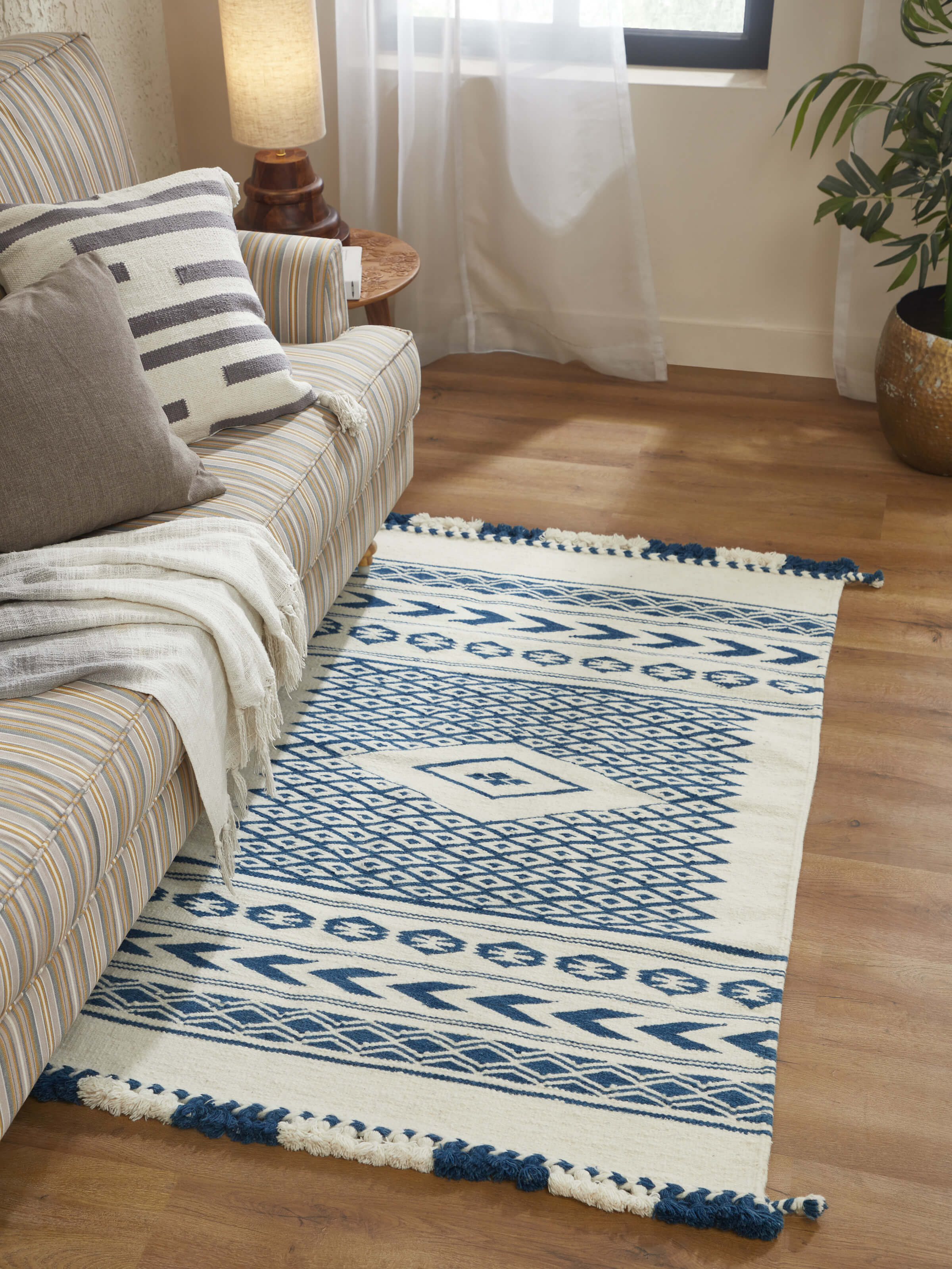 Detailed close-up of Traditional geo ivory indigo Gujarat wool & cotton panja dhurrie kharad (3x5 ft) highlighting the intricate weaving and color scheme.