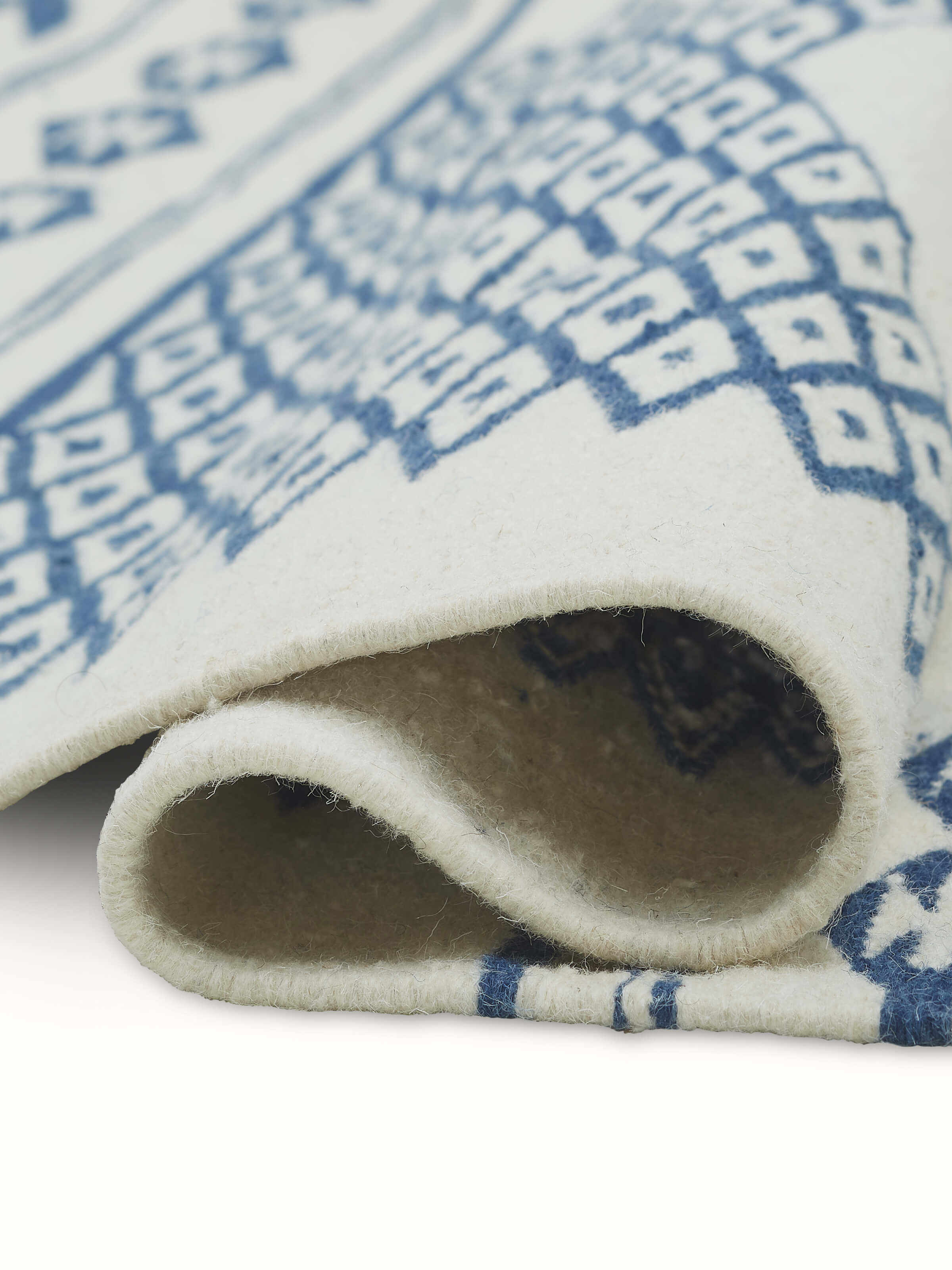 Close-up view of Traditional geo ivory indigo Gujarat wool & cotton panja dhurrie kharad (3x5 ft) focusing on the wool and cotton blend and pattern details.