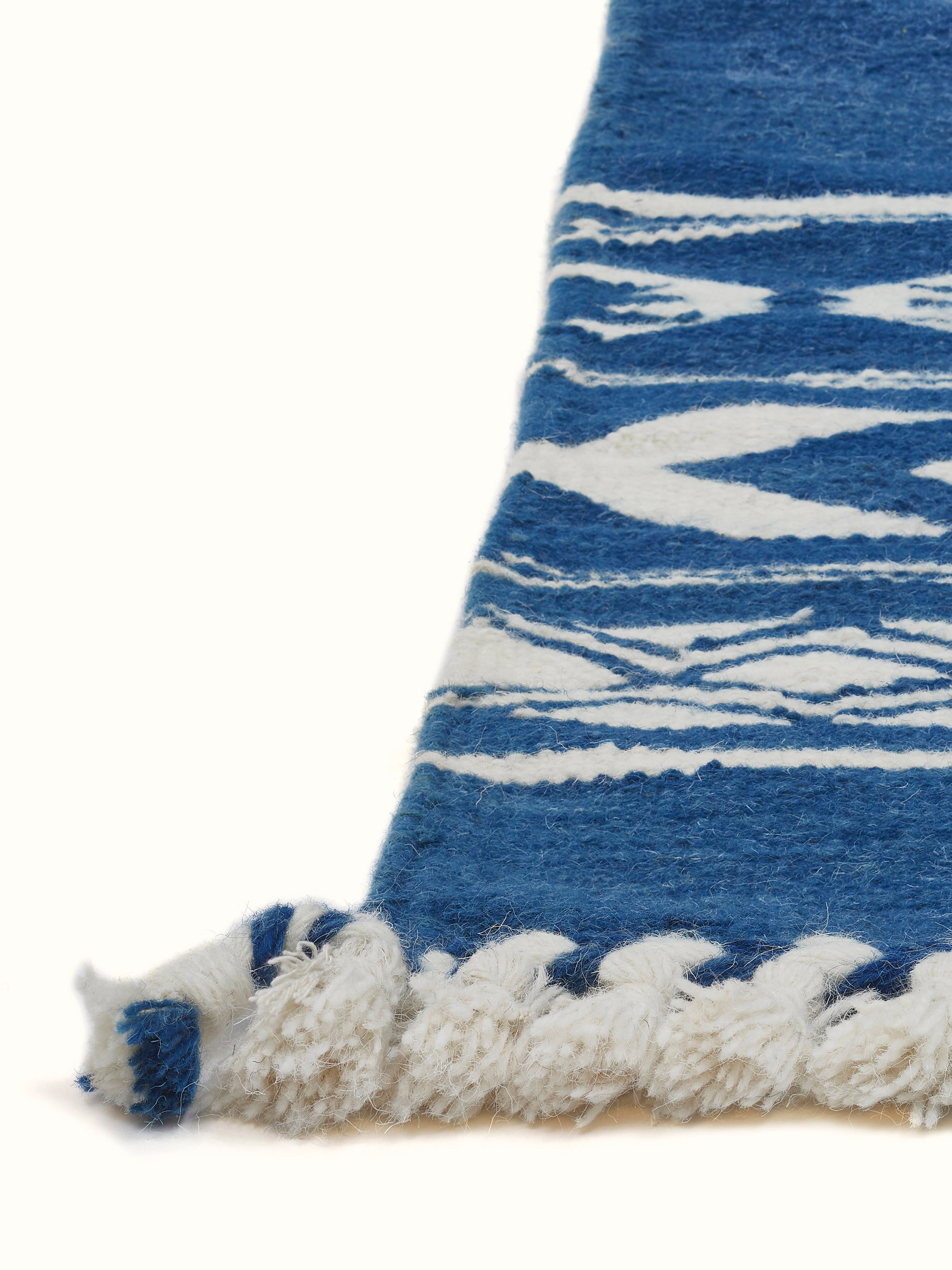 Detailed view of Traditional Geo Indigo Ivory Gujarat wool & cotton panja dhurrie kharad (4x6 ft), highlighting the indigo and ivory color scheme.