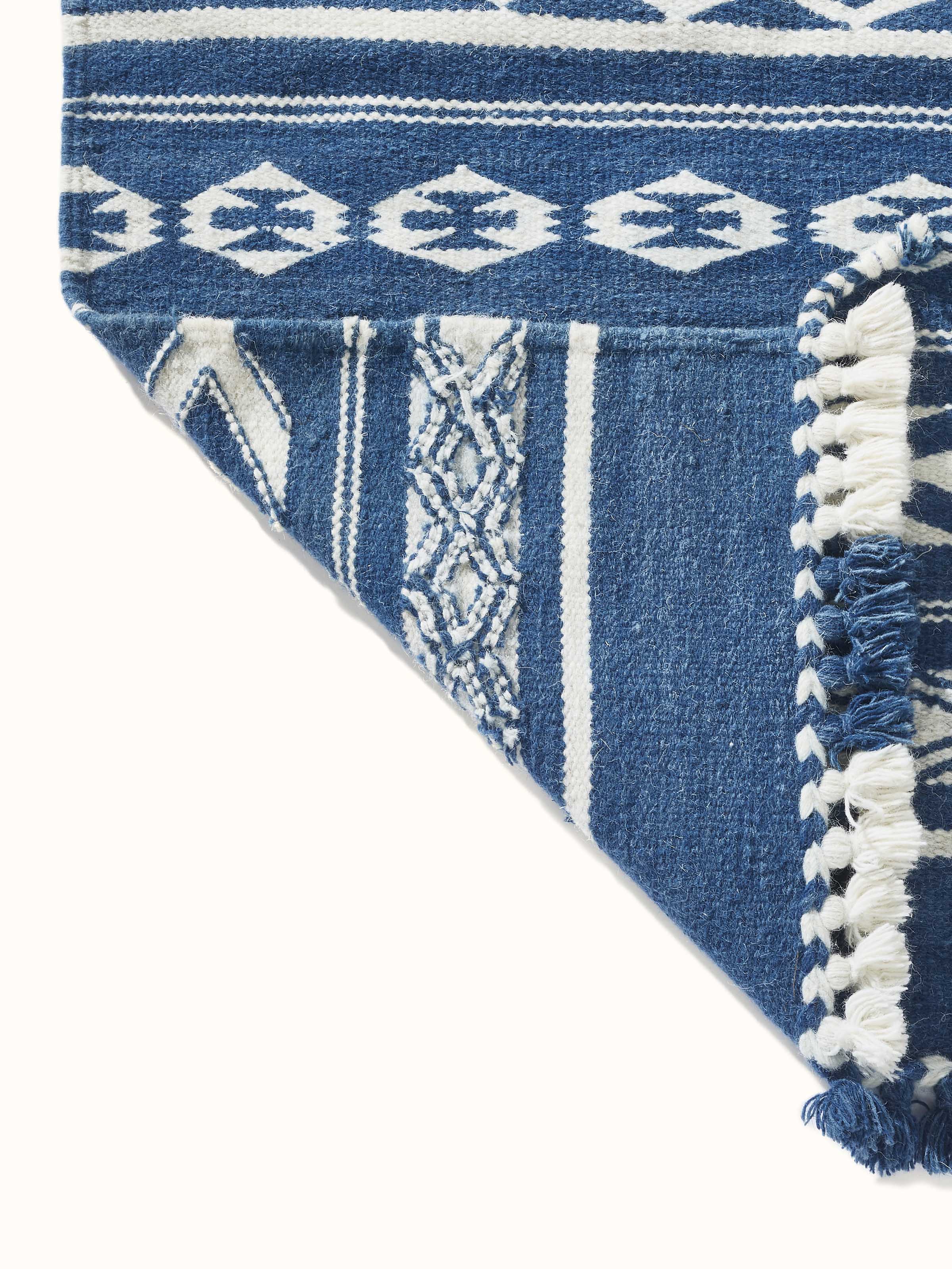 Traditional Geo Indigo Ivory Gujarat wool & cotton panja dhurrie kharad (4x6 ft) with close-up of the geometric pattern and fabric weave.