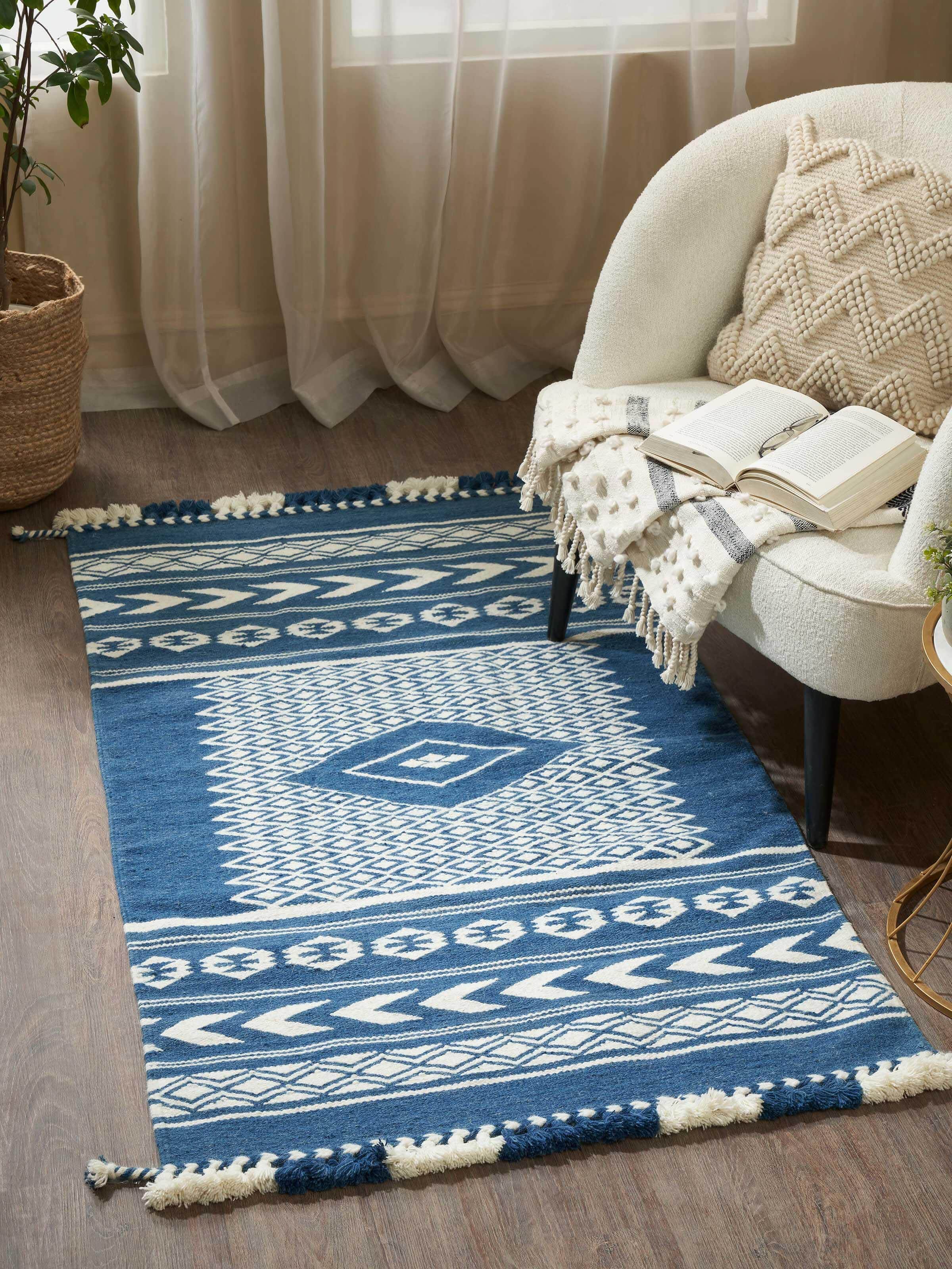 Side view of Traditional Geo indigo ivory Gujarat wool & cotton panja dhurrie kharad (3x5 ft) emphasizing its texture and edge details.