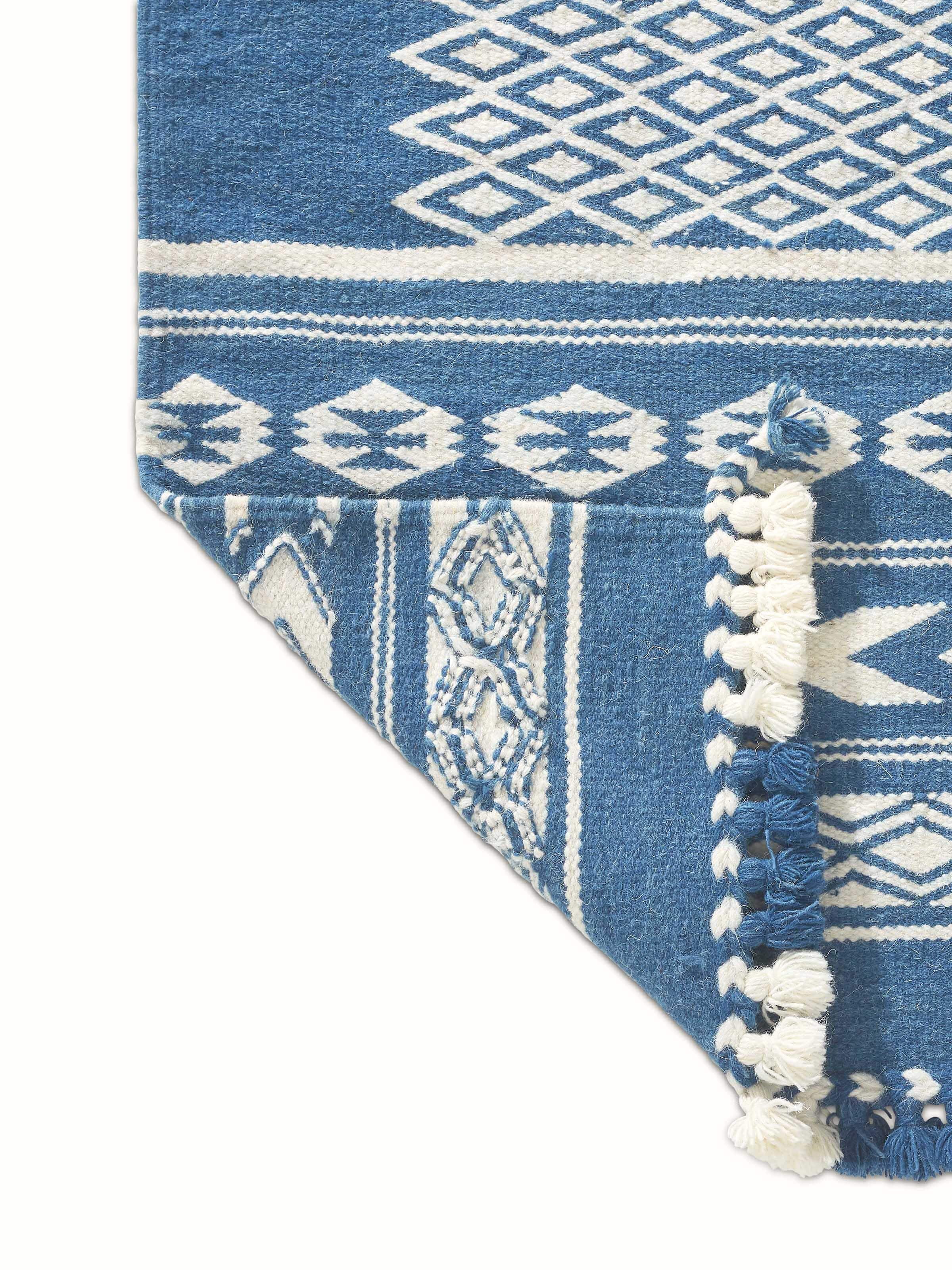 Perspective view of Traditional Geo indigo ivory Gujarat wool & cotton panja dhurrie kharad (3x5 ft) displaying the overall look and design depth.