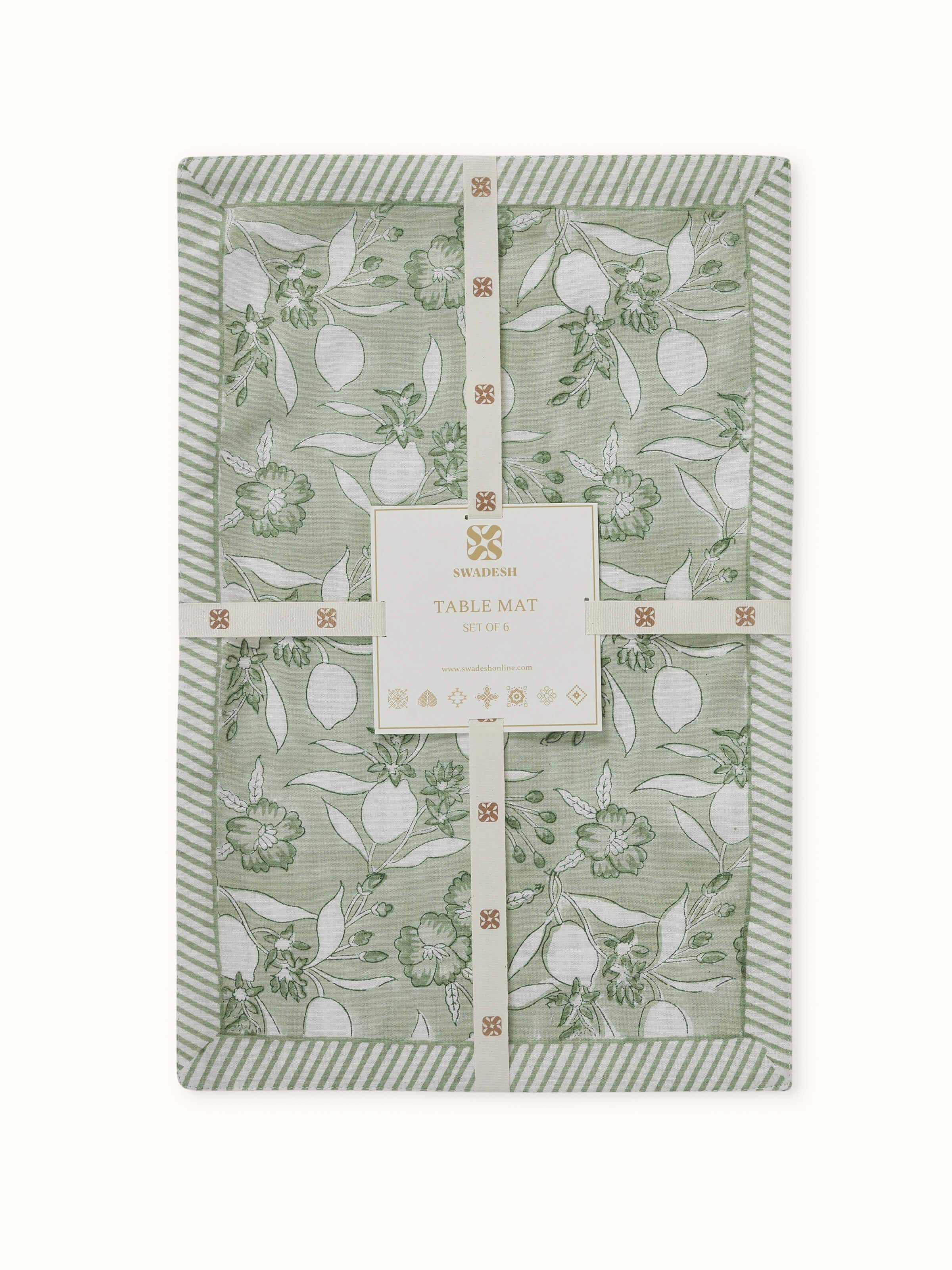 Side view showing complete mat set with green floral Sanganeri patterns.