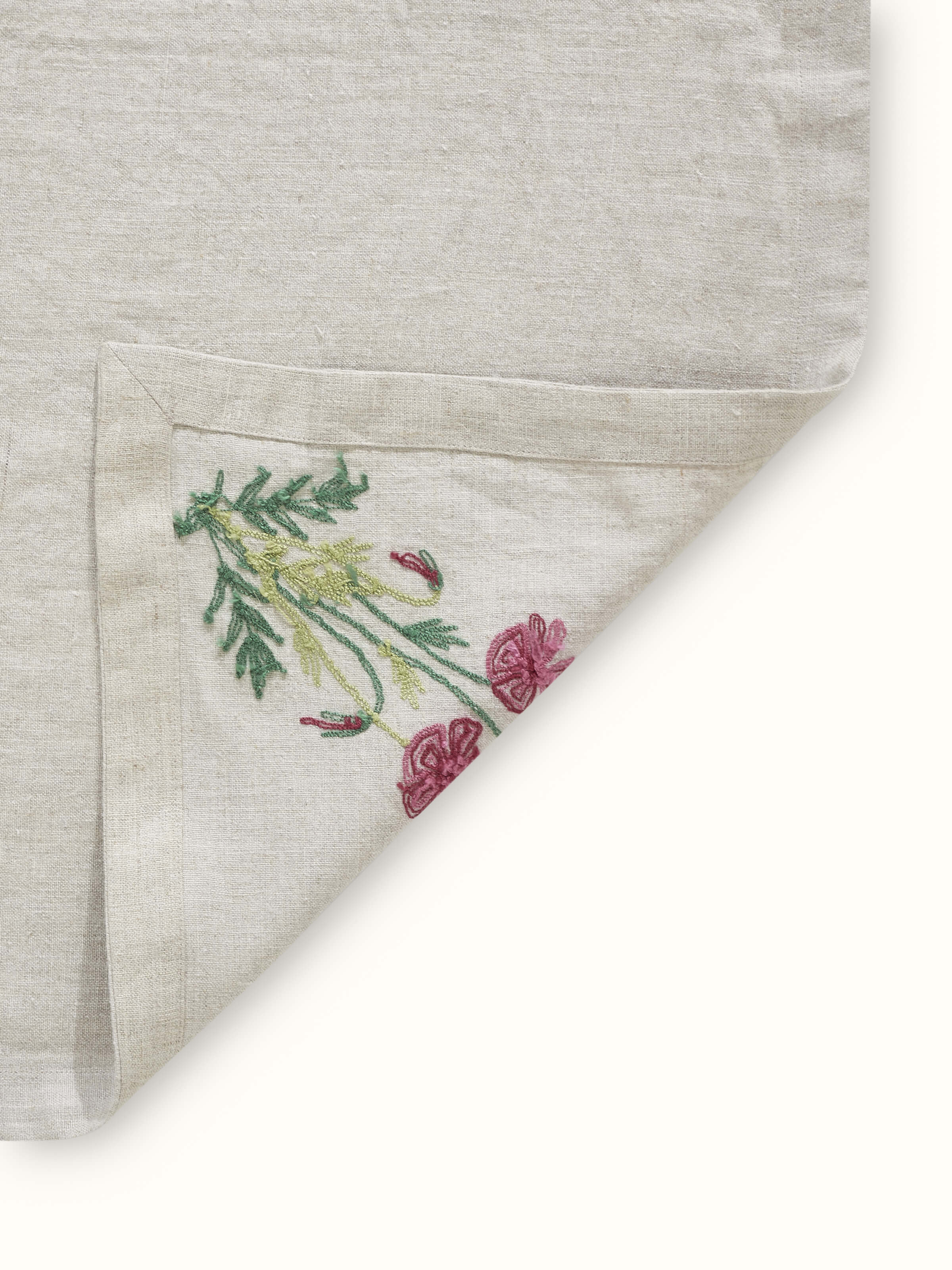 Side view of Mughal Beige Floral Linen Kashmir Chain Stitch Embroidered Table Cover, showcasing the table cover’s design and embroidery quality.