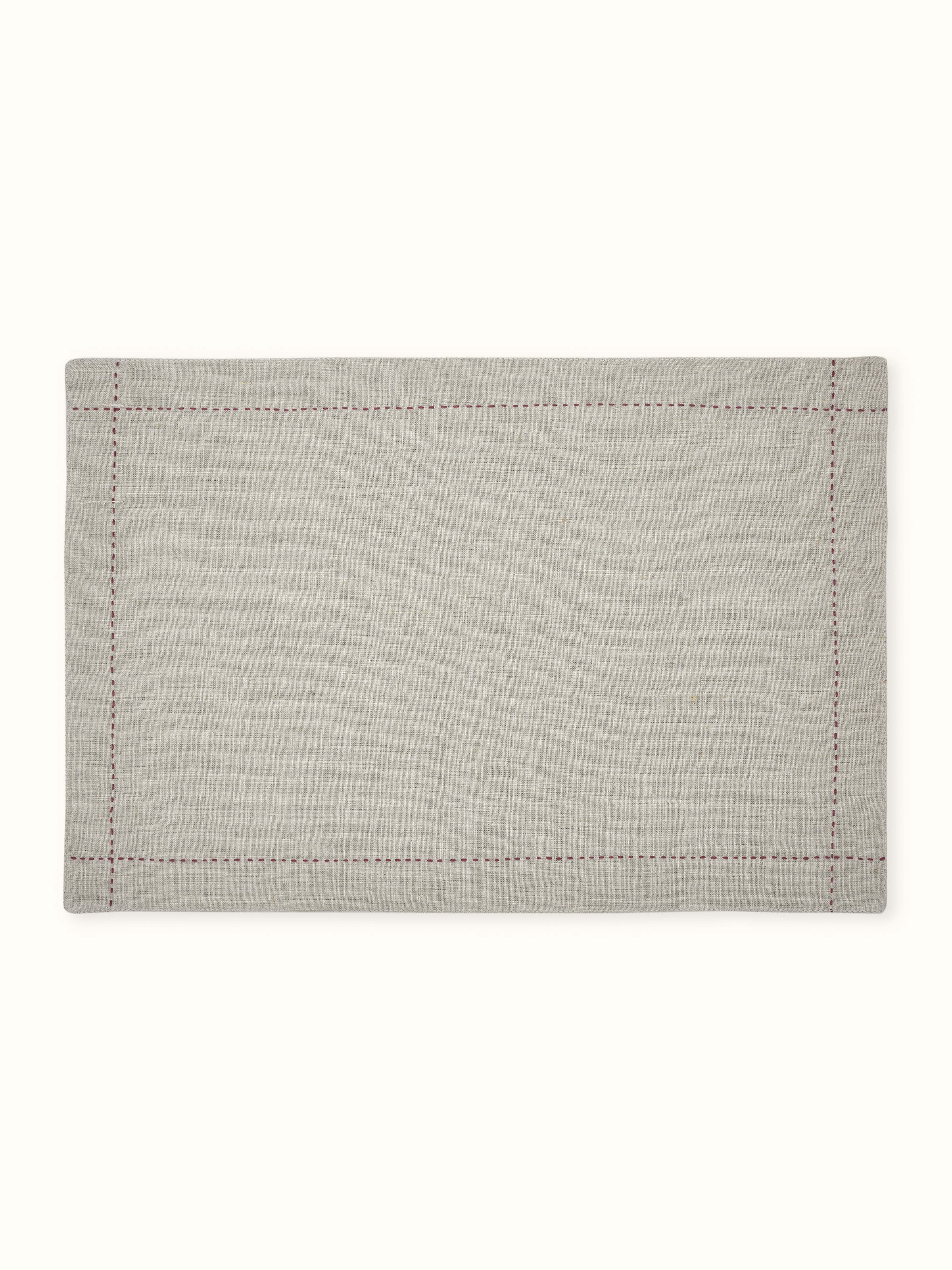 Front view of beige linen table mat set with subtle hand embroidery, ideal for elegant dining.