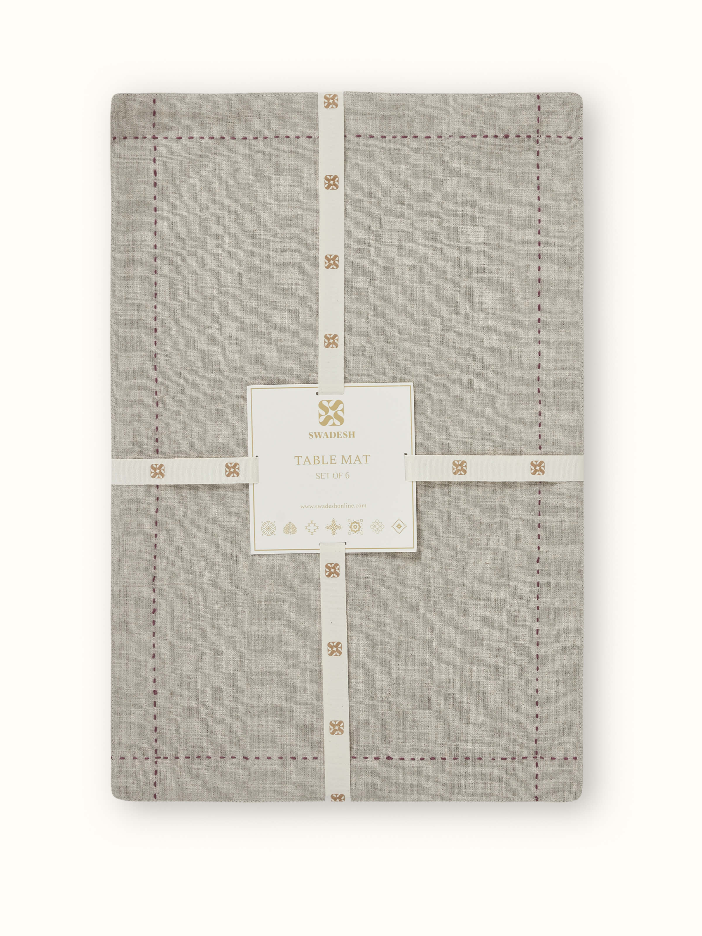 Close-up of hand embroidery and linen weave on Mughal beige table mat.