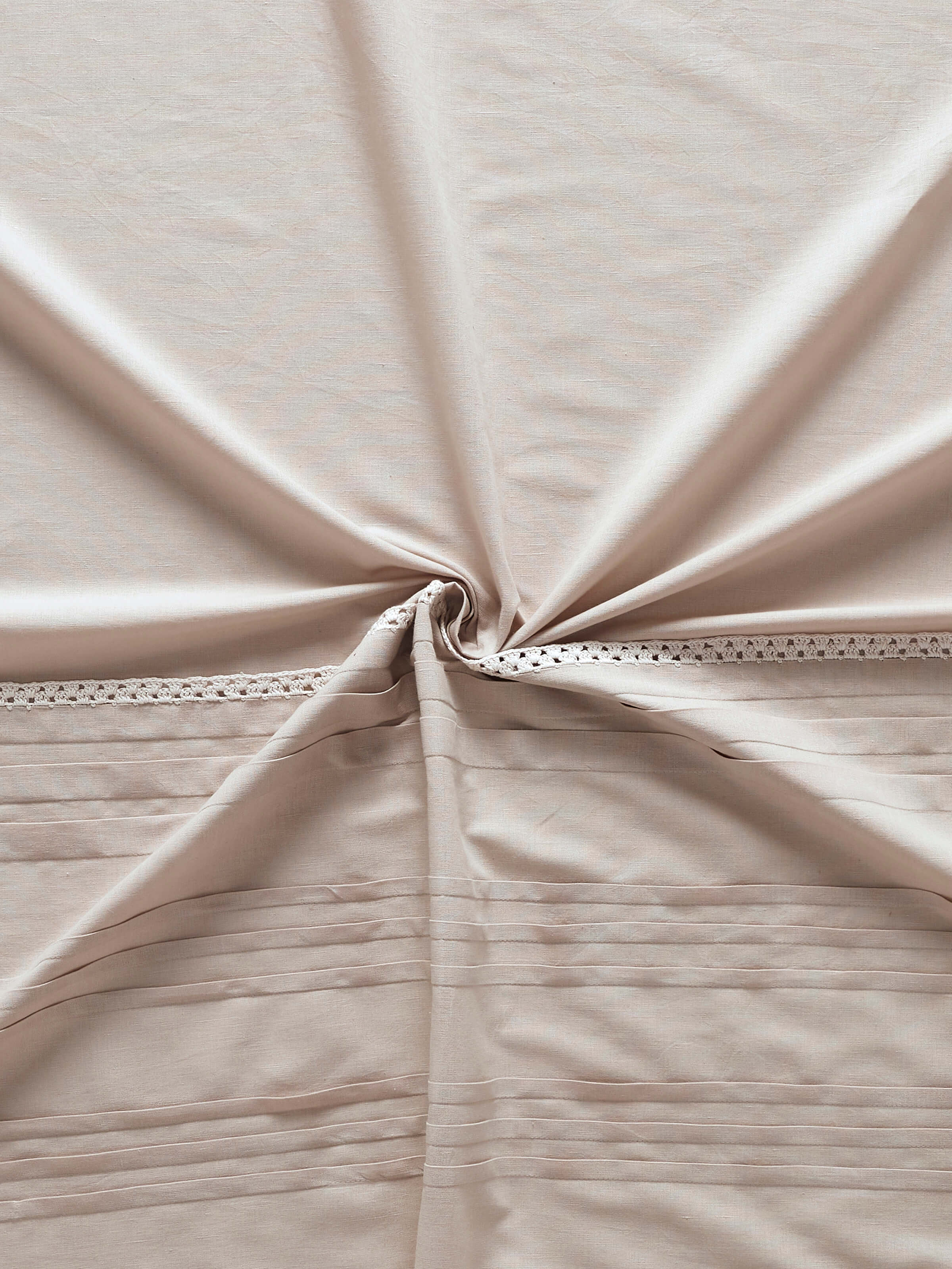 Nityam beige solid cotton linen crochet curtain, side view showing the length and material in natural light.