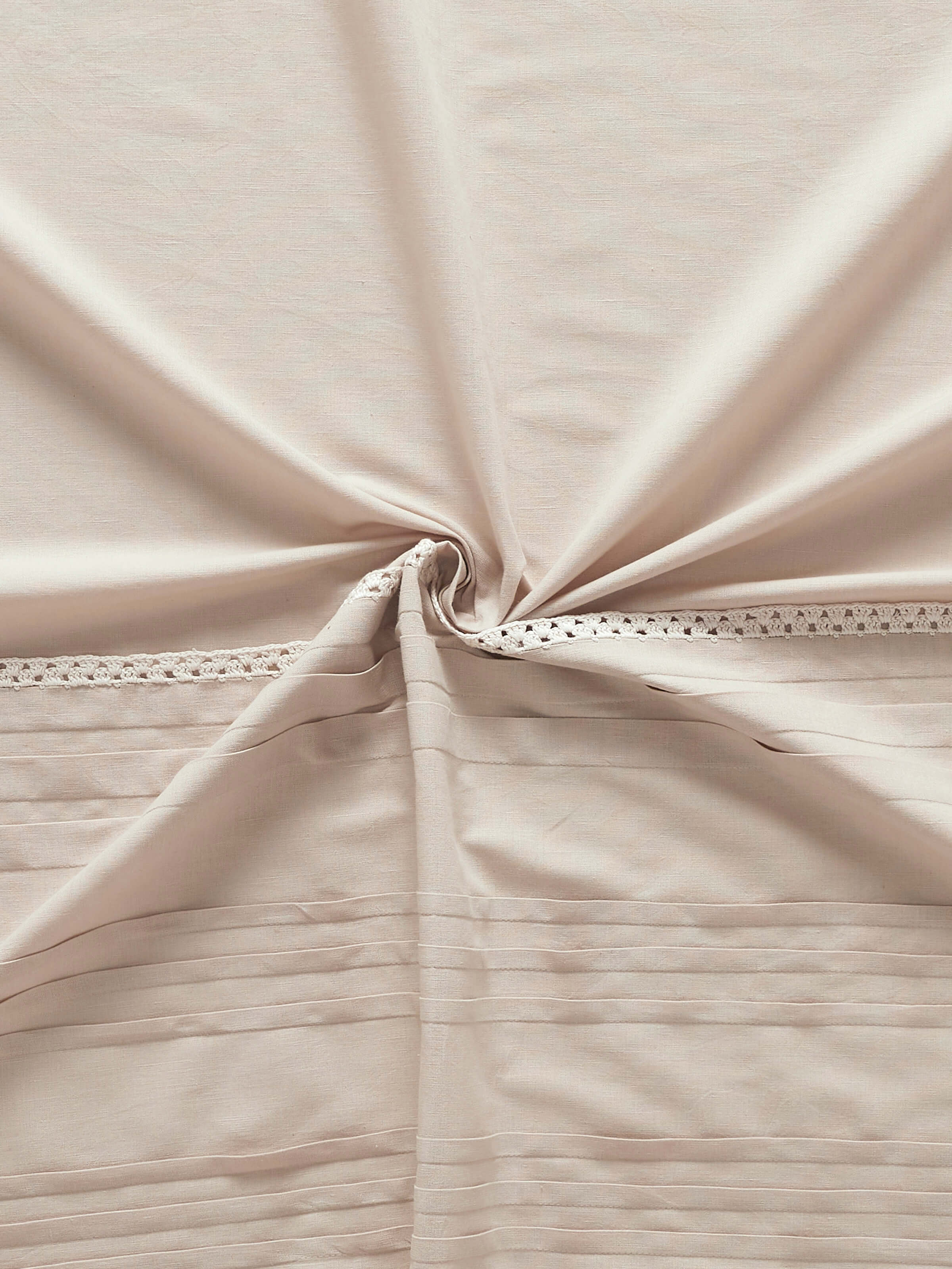 Perspective view of Nityam beige solid cotton linen crochet curtain (7 ft) showing the curtain’s length and design.