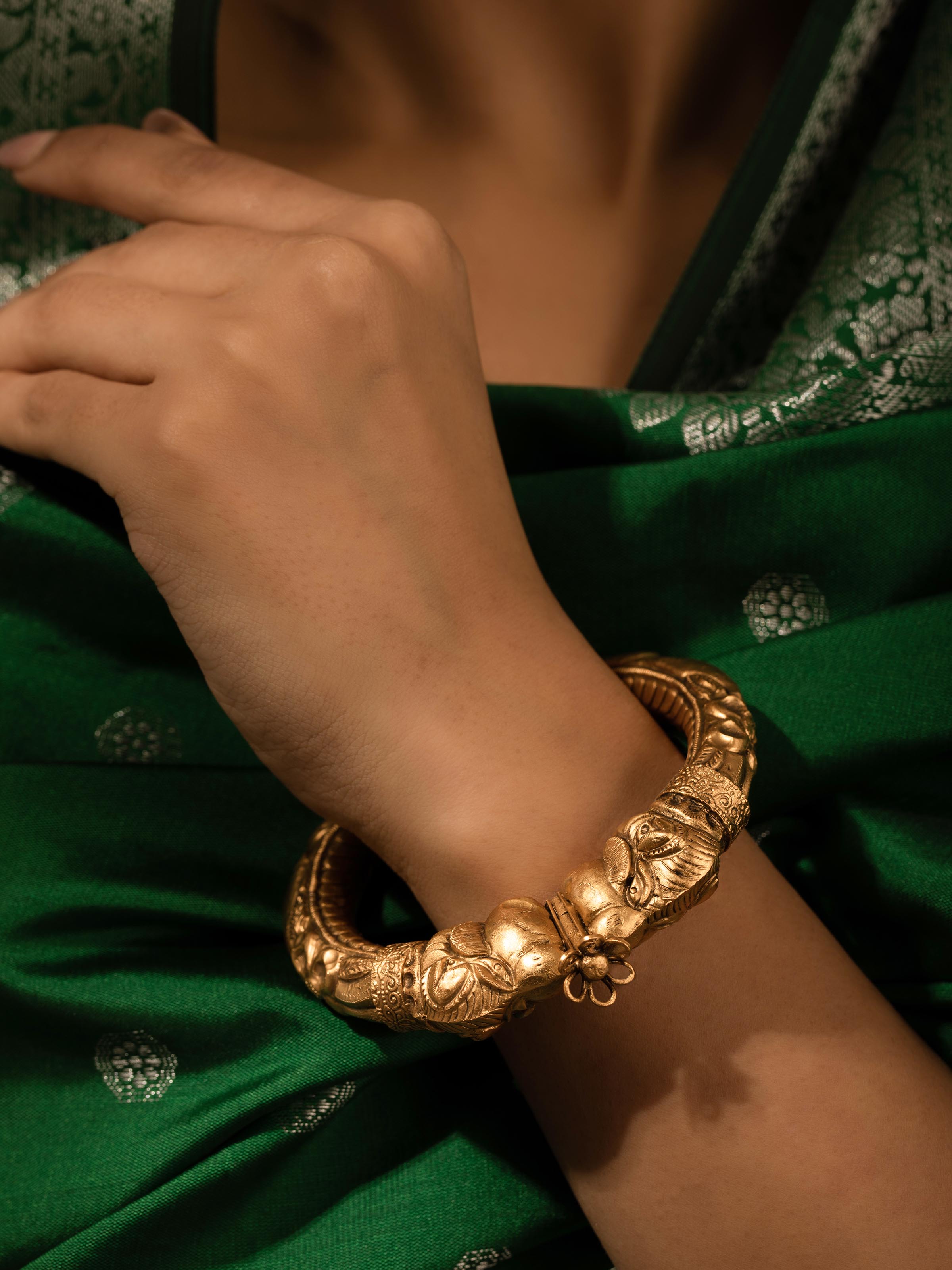Close-up view of Silversmithing Kada emphasizing the fine silverwork and intricate details