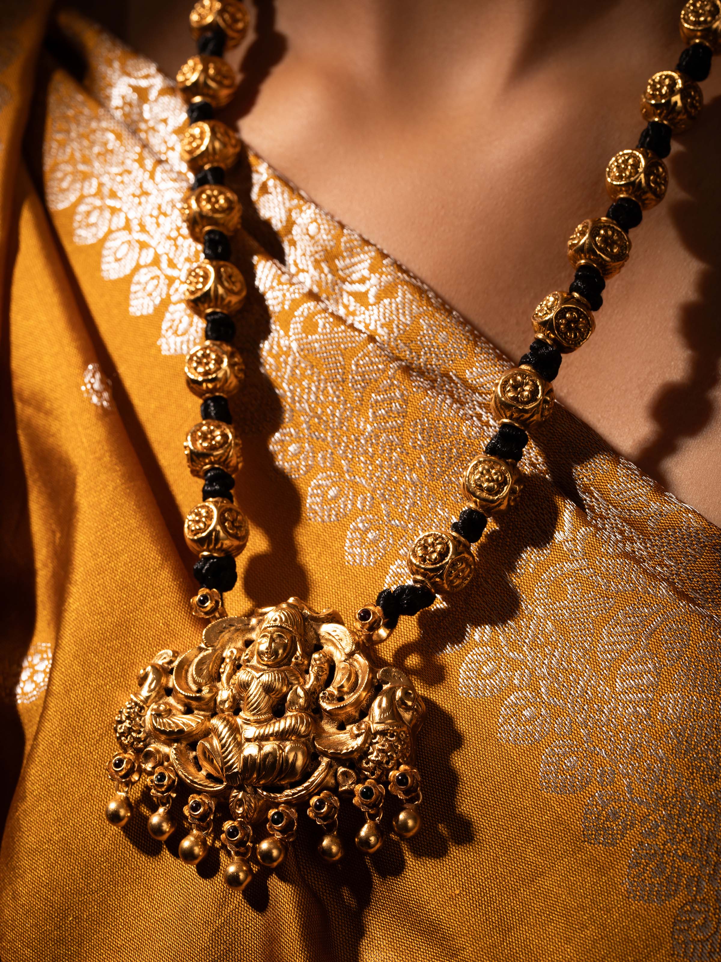 Close-up view of Silversmithing Long Necklace showcasing the polished silver finish and fine craftsmanship